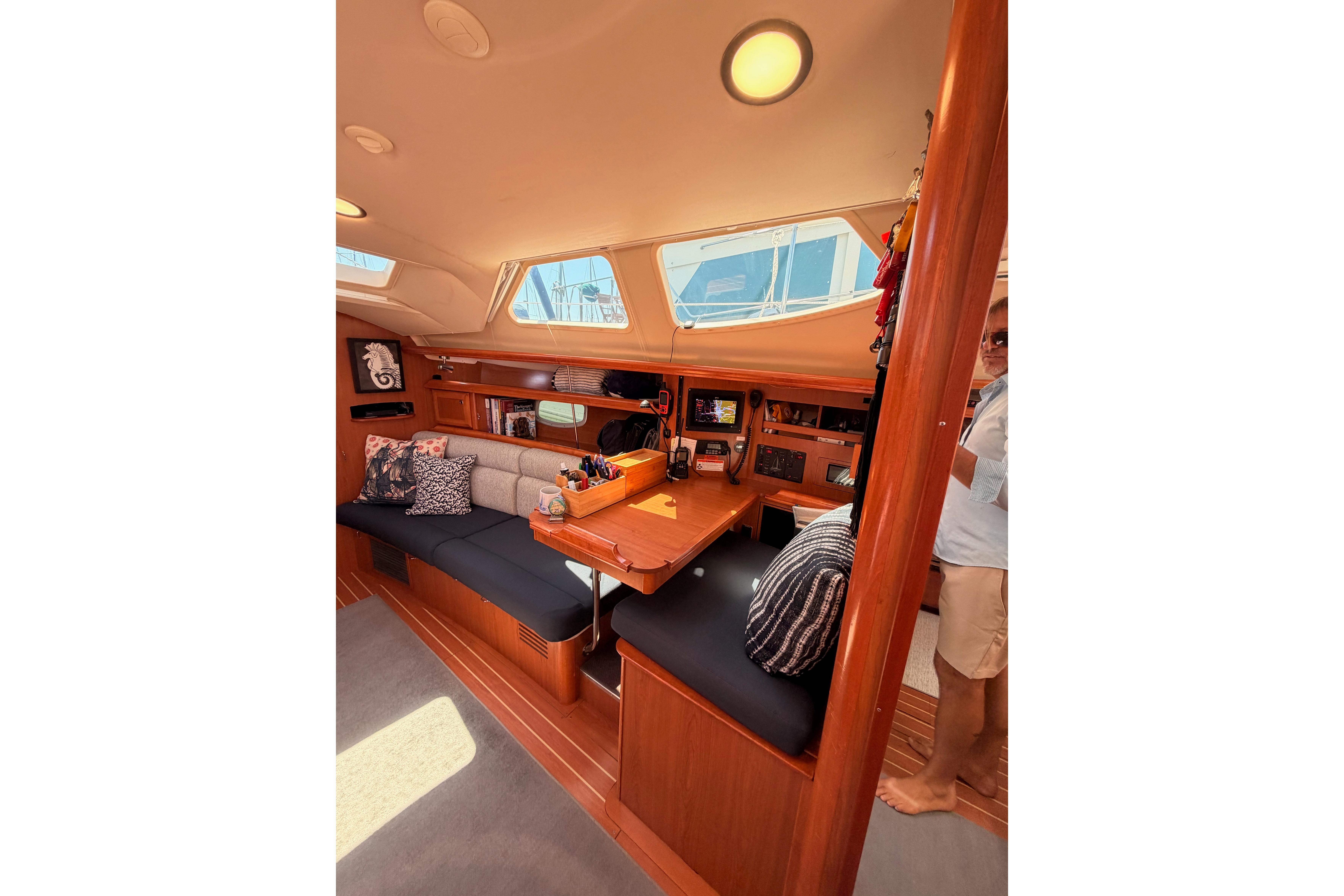 Interior of 2008 Hunter 45 Deck Salon yacht with cozy seating and navigation area.