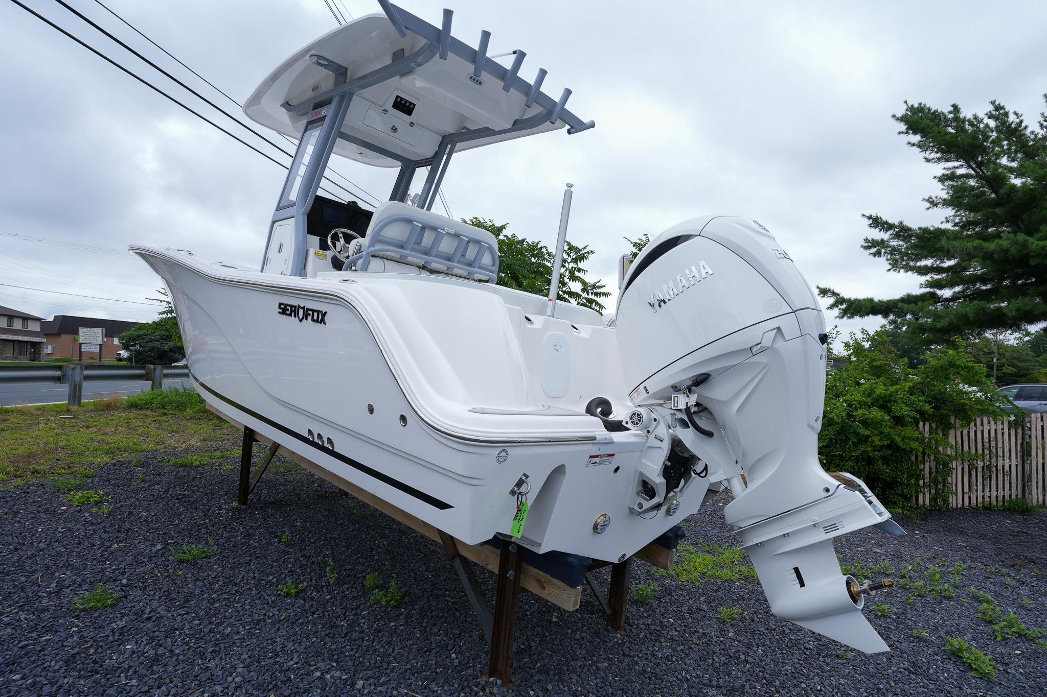 2026 Sea Fox 228 Commander boat with Yamaha engine on display outdoors.