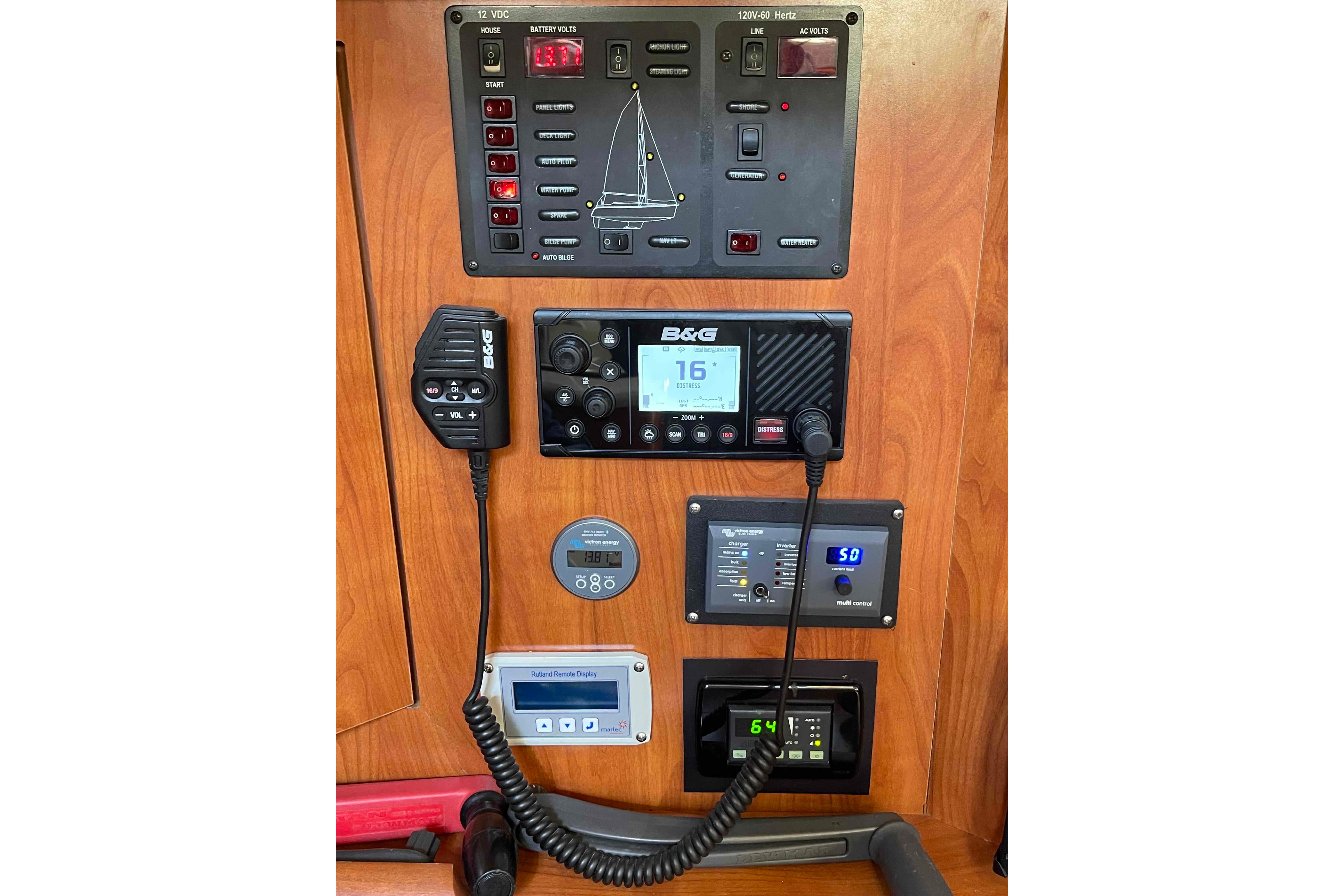 Control panel of 2010 Hunter 45 Center Cockpit sailboat with navigation and communication equipment.