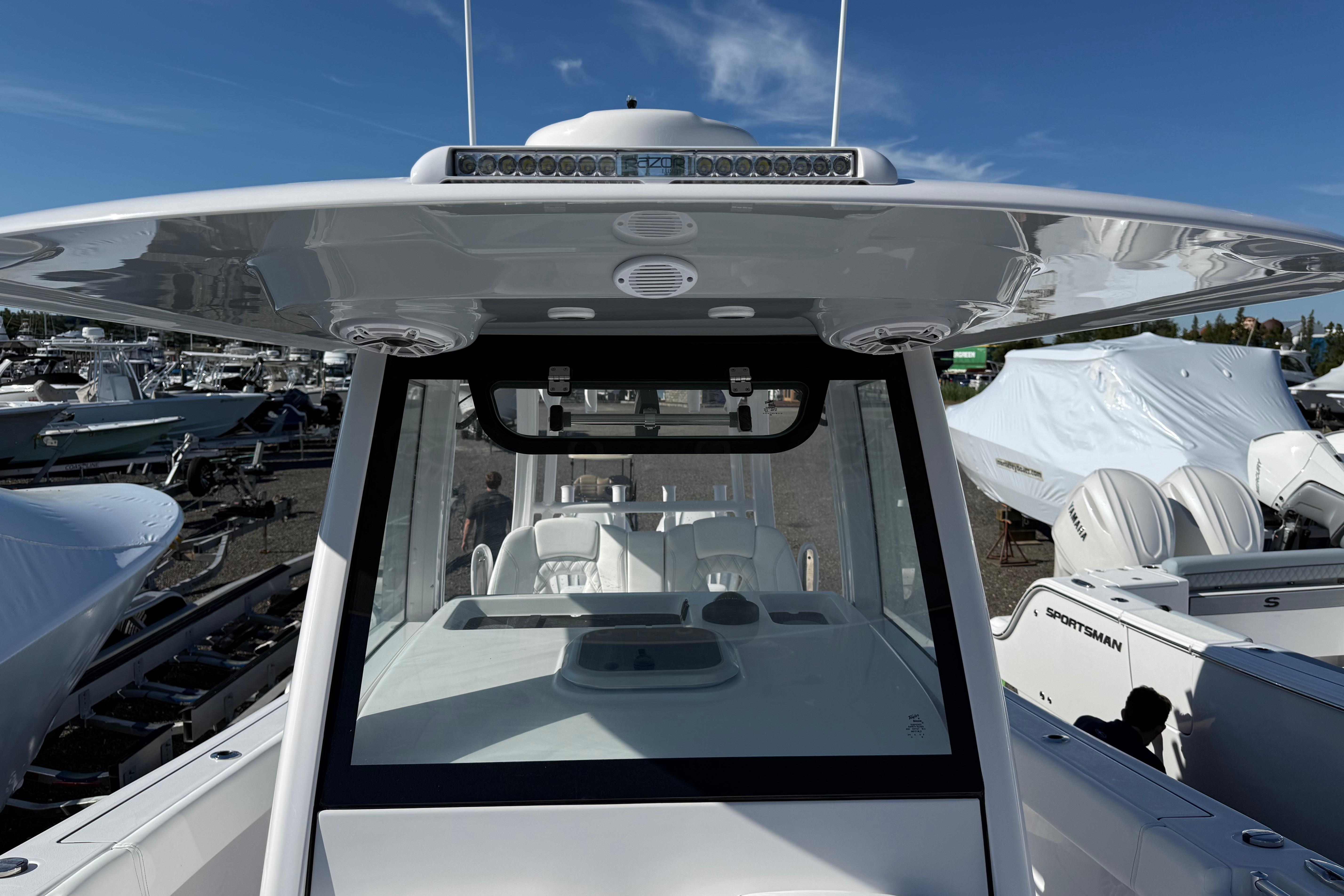 2026 Sportsman Open 302 Center Console boat with sleek design and advanced features.