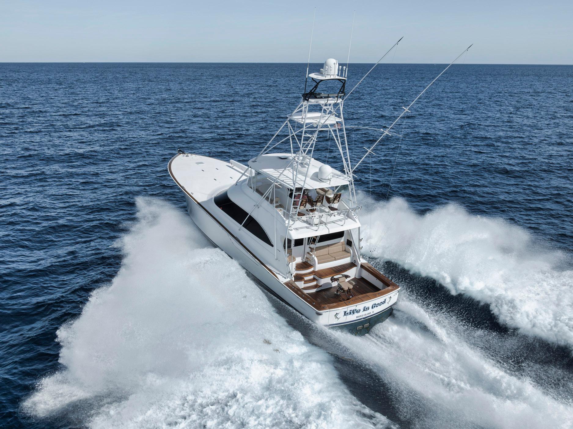 Viking 70 Convertible yacht cruising on open sea, 2015 model.