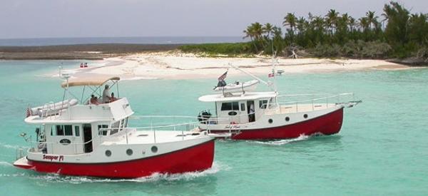 Two Great Harbour N40 boats cruising near a tropical island, 2025 model.
