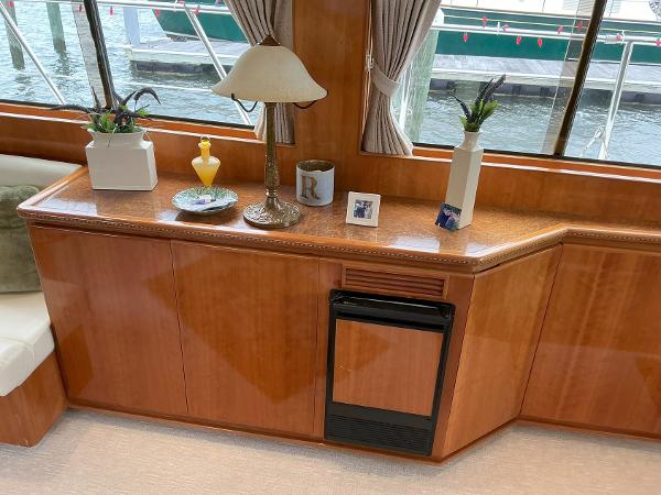 Interior of 2000 Novatec Islander 55 yacht with elegant wooden cabinetry and decor.