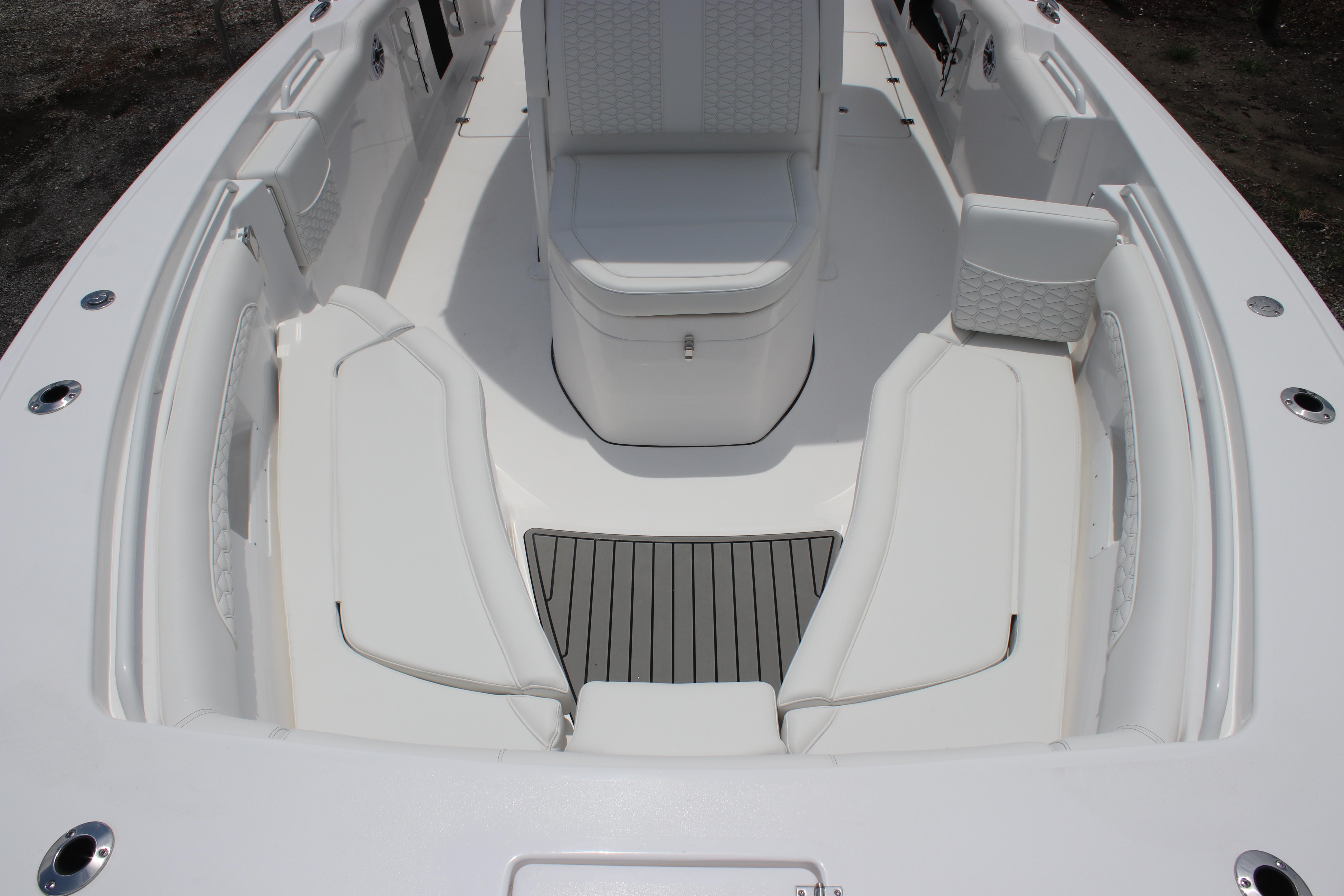 2026 Tidewater 272 LXF boat interior with white seating and sleek design.