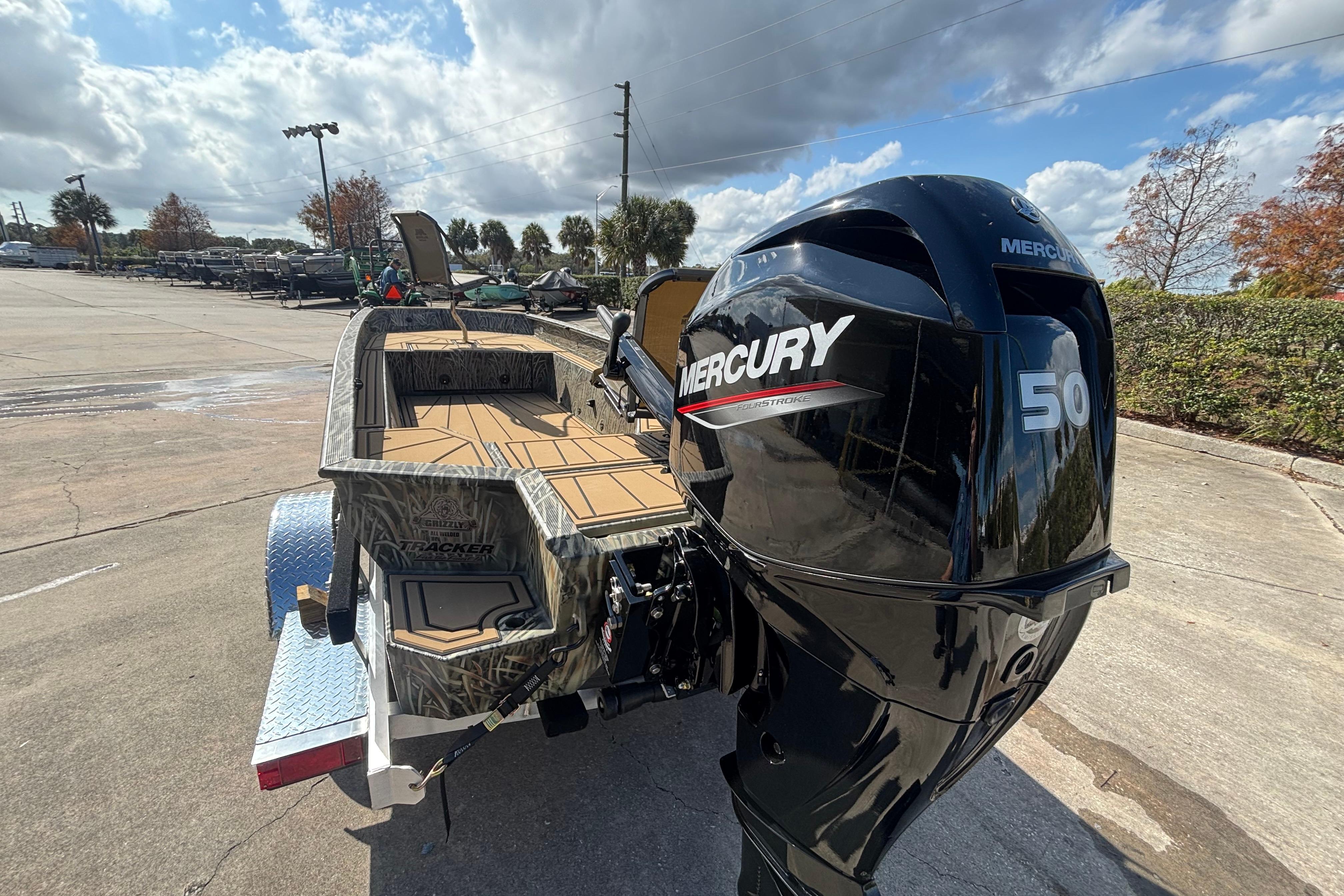2026 Tracker Grizzly 1650 T Prairie Wings Edition boat with Mercury 50 outboard motor.