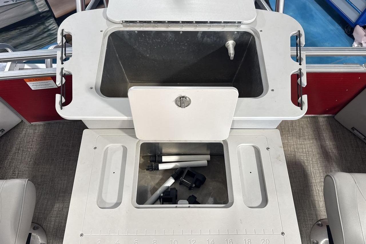 Interior view of a 2022 Landau ALURE 232 boat with storage compartments.