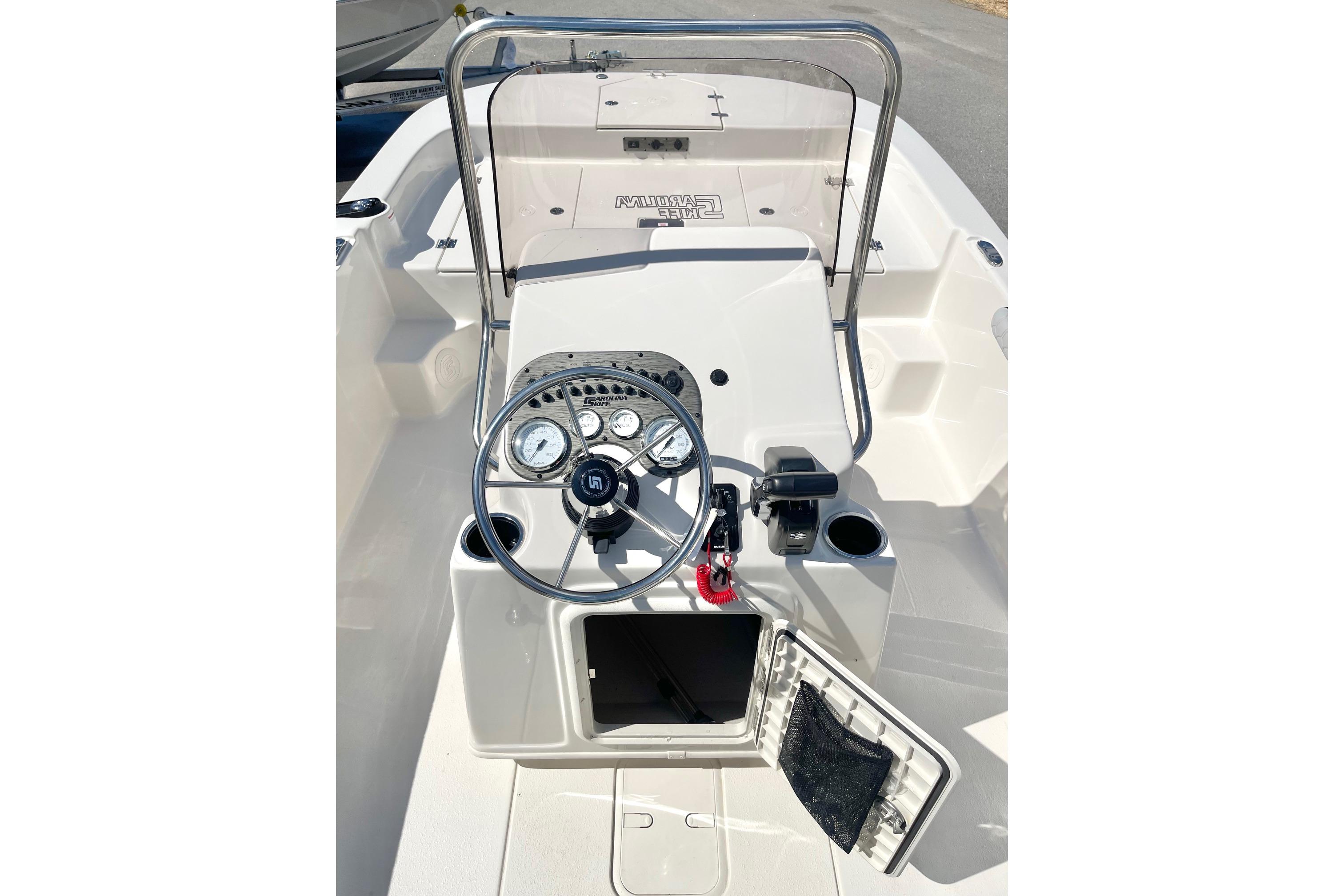 2026 Carolina Skiff 19 LS boat console with steering wheel and gauges.