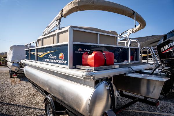 2025 Sun Tracker Bass Buggy 16 DLX pontoon boat with canopy and fuel tanks.