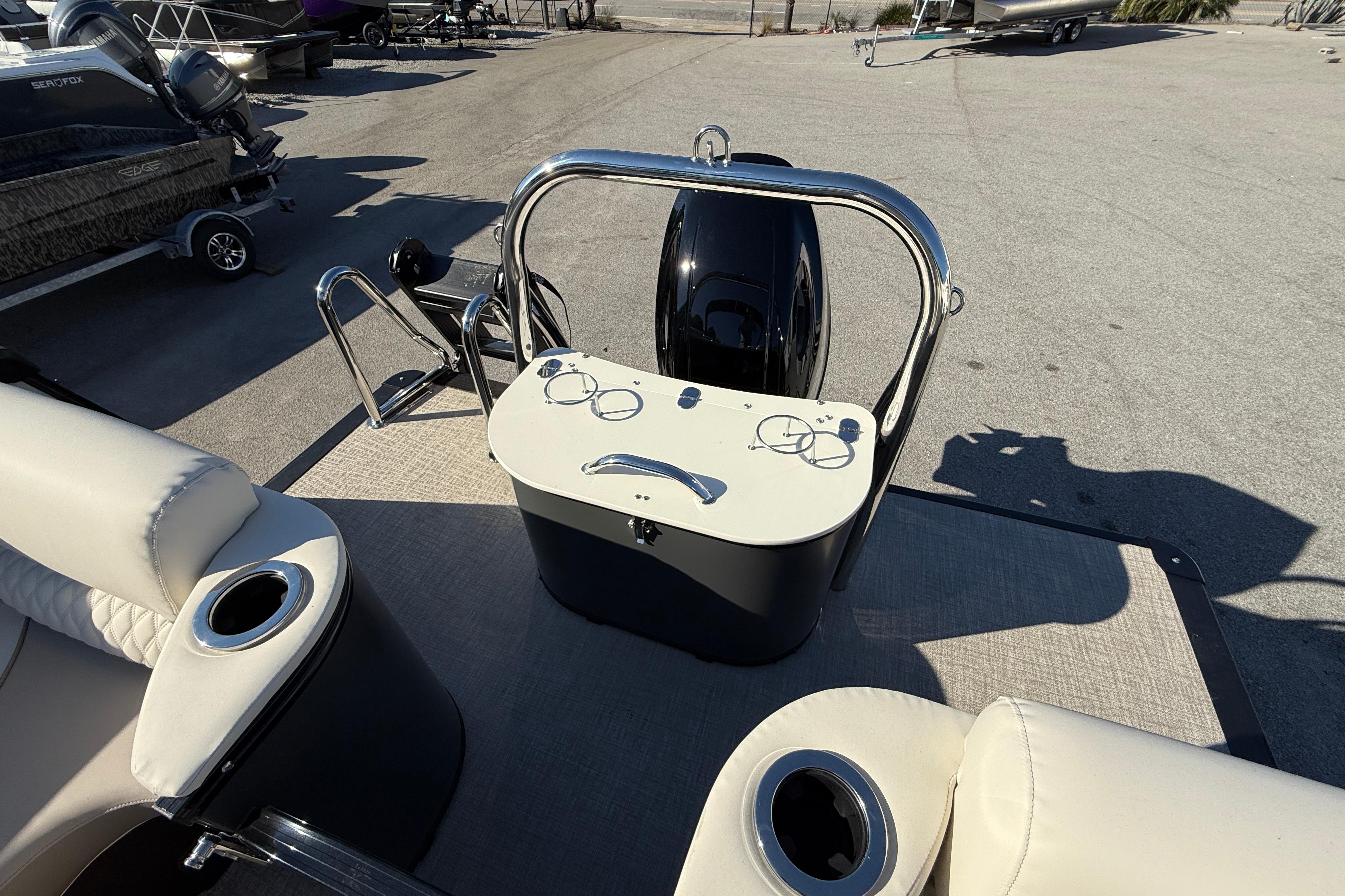 2026 Tahoe Pontoon Cascade Quad Lounger Windshield, rear view with seating and motor.
