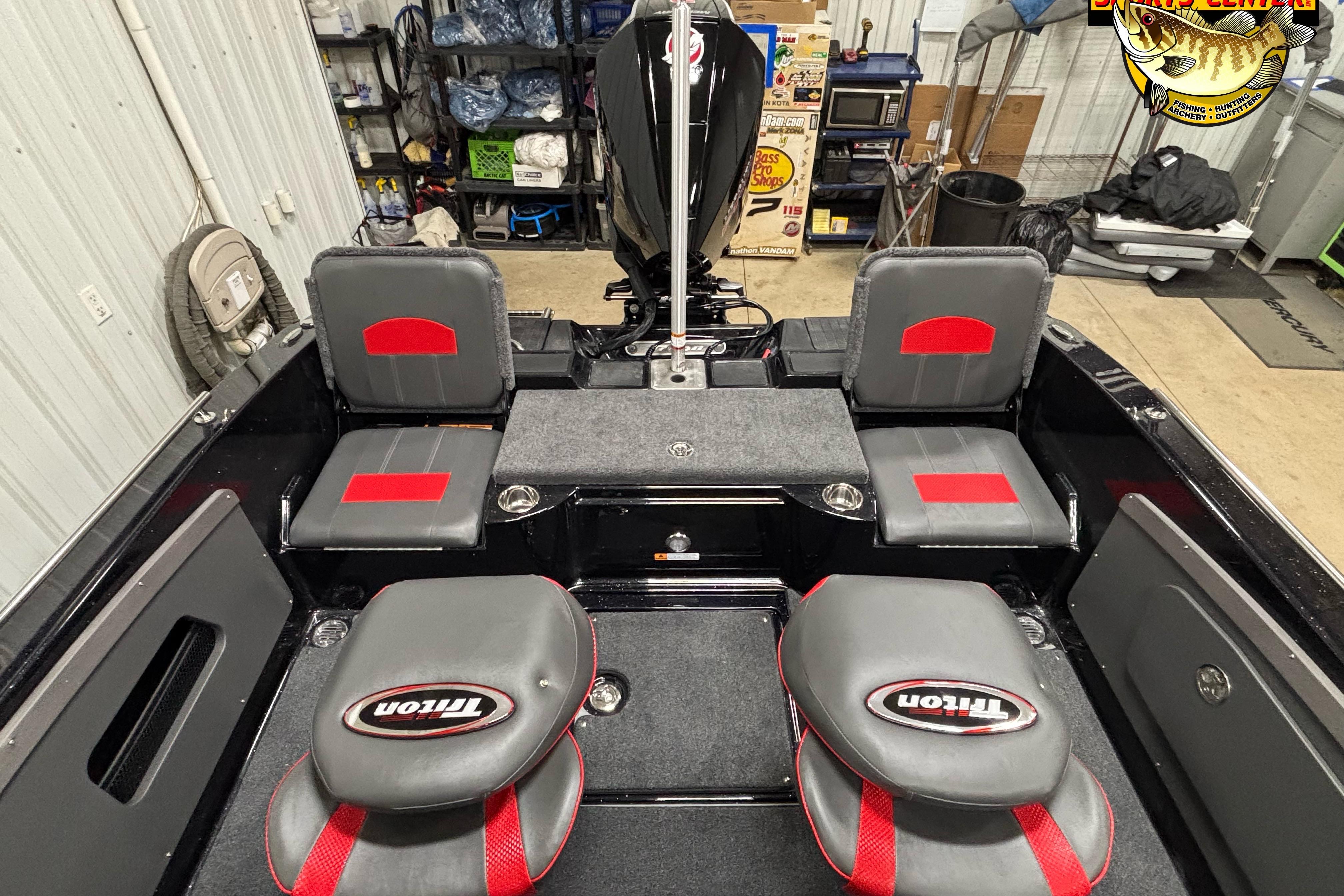 2026 Triton 206 Allure boat interior with gray and red seating in a garage setting.