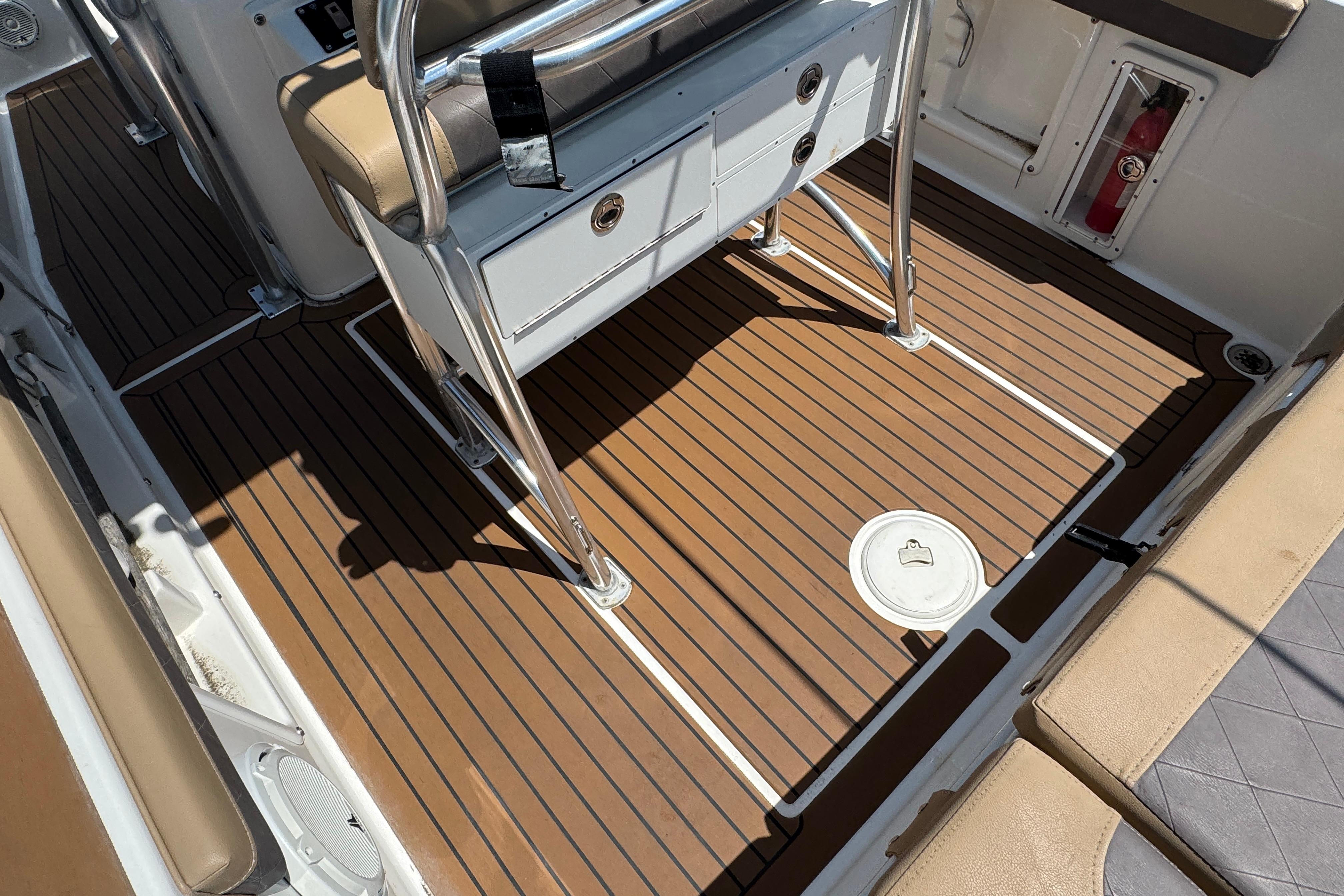 2014 Century 2301 Center Console boat interior with teak flooring and seating.
