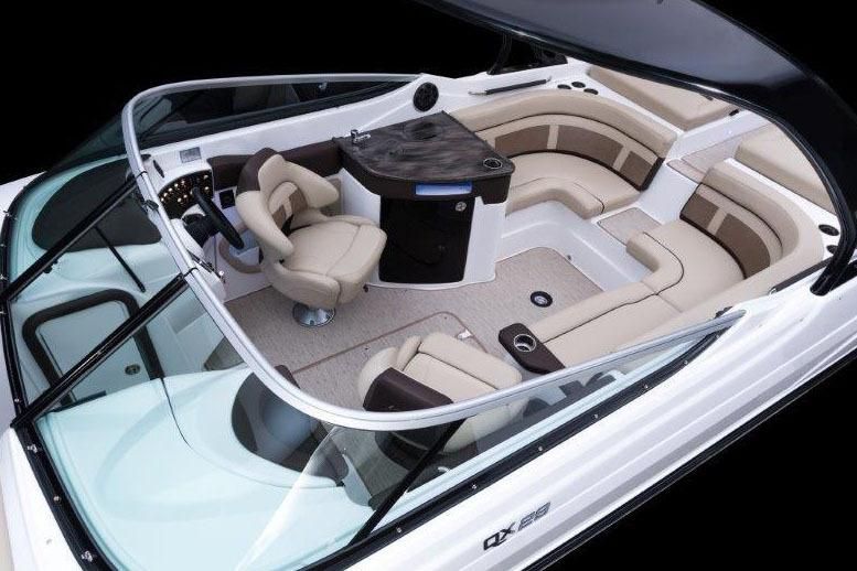 Interior of a 2017 Rinker QX29 BR boat with luxurious seating.
