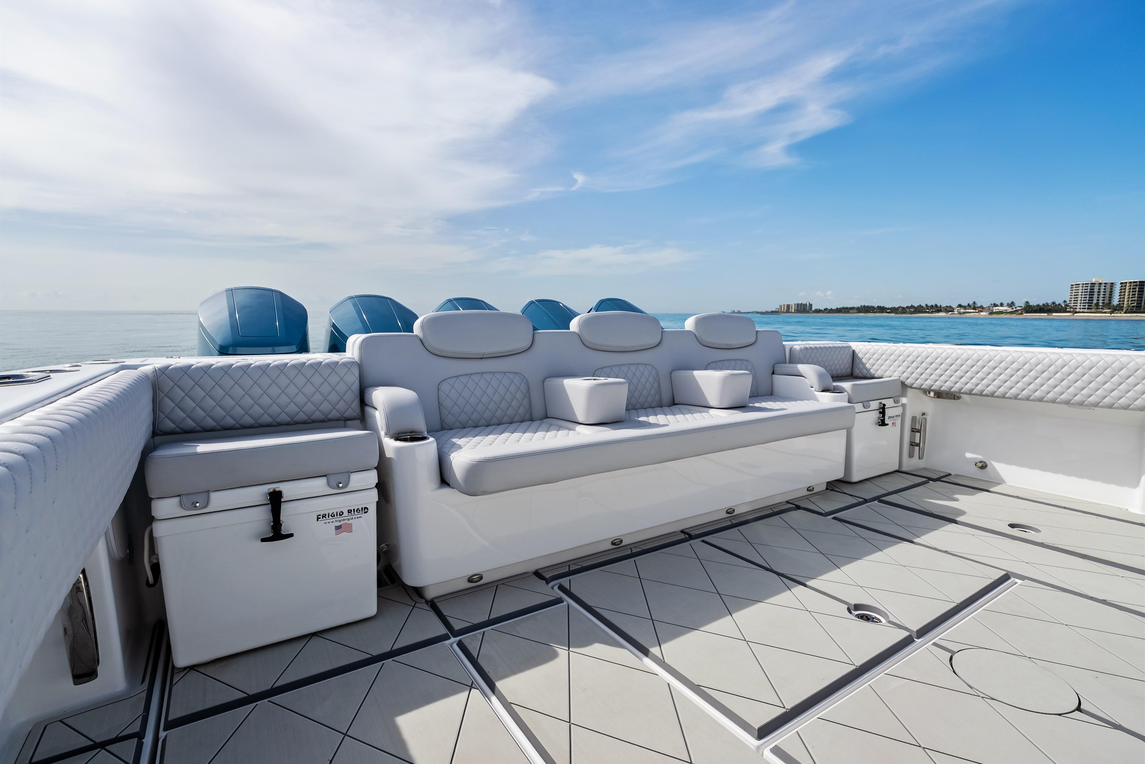 Luxurious seating on the 2025 HCB 56 Suenos GIX yacht, with ocean view.