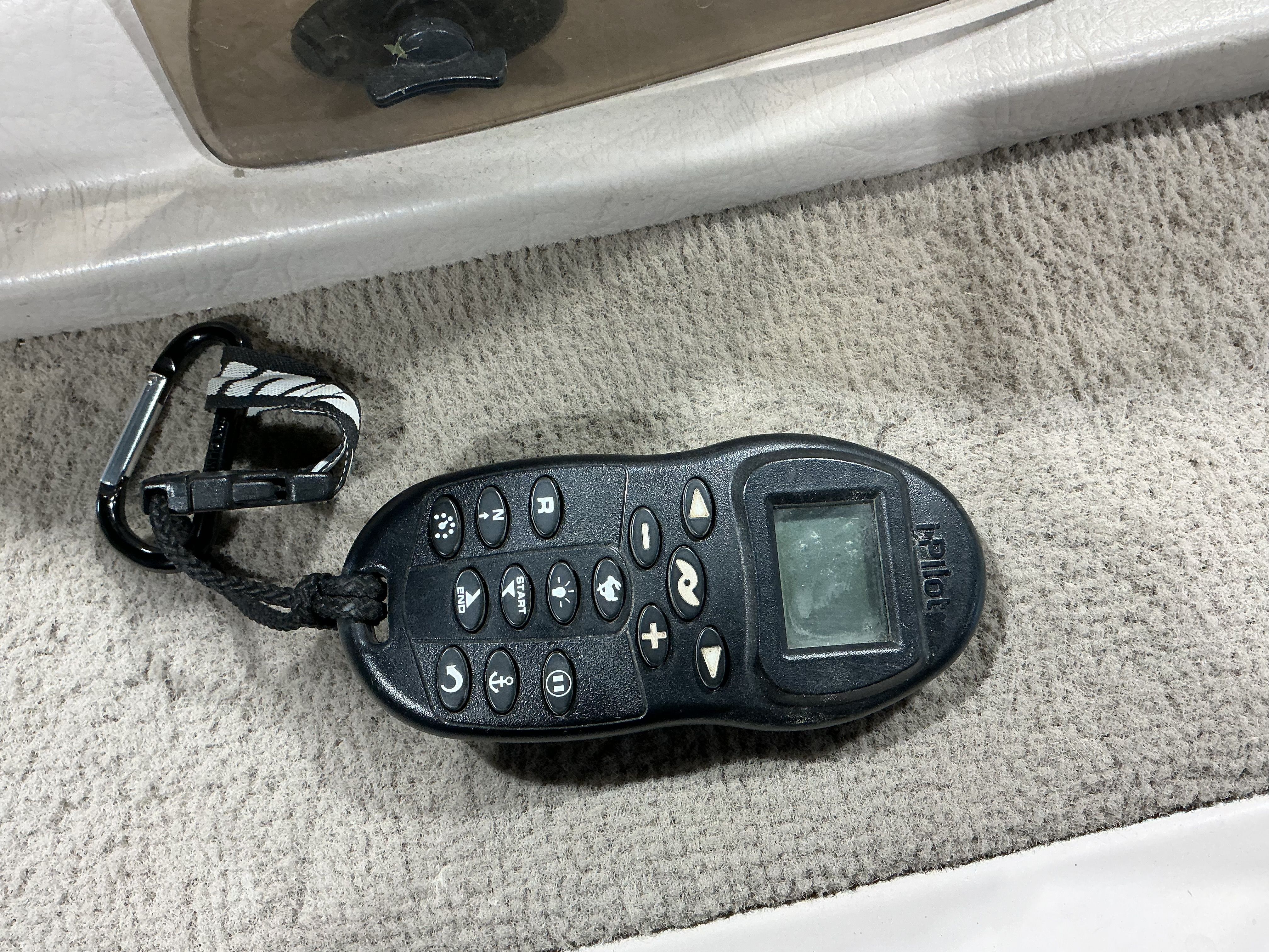 Remote control on gray carpet in Sylvan EXPEDITION 1999.