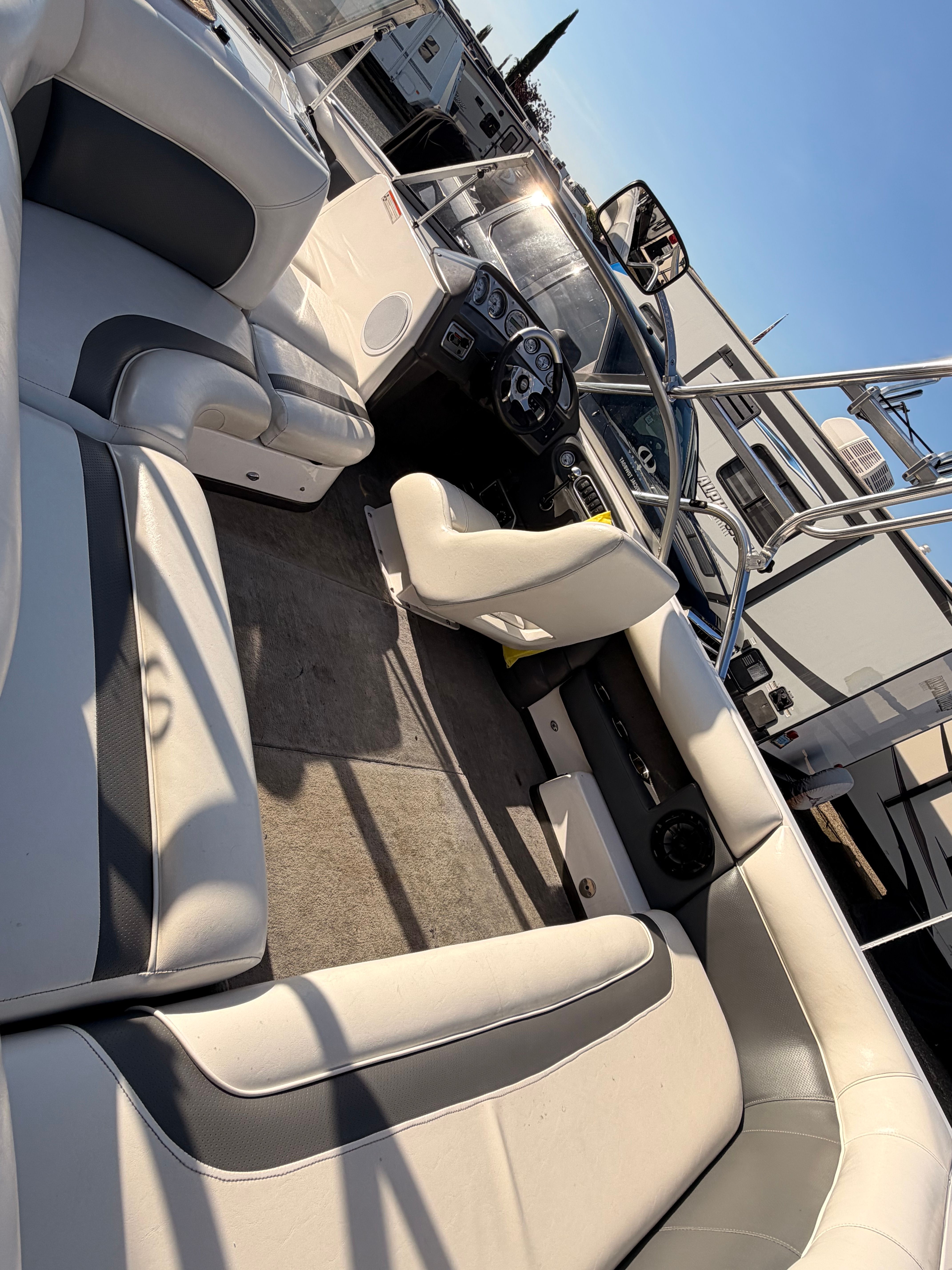 Interior of a 2004 Supra Launch SSV boat with gray seating.