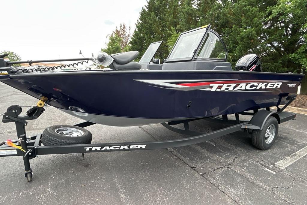 2025 Tracker Pro Guide V-175 WT boat on trailer, parked outdoors.