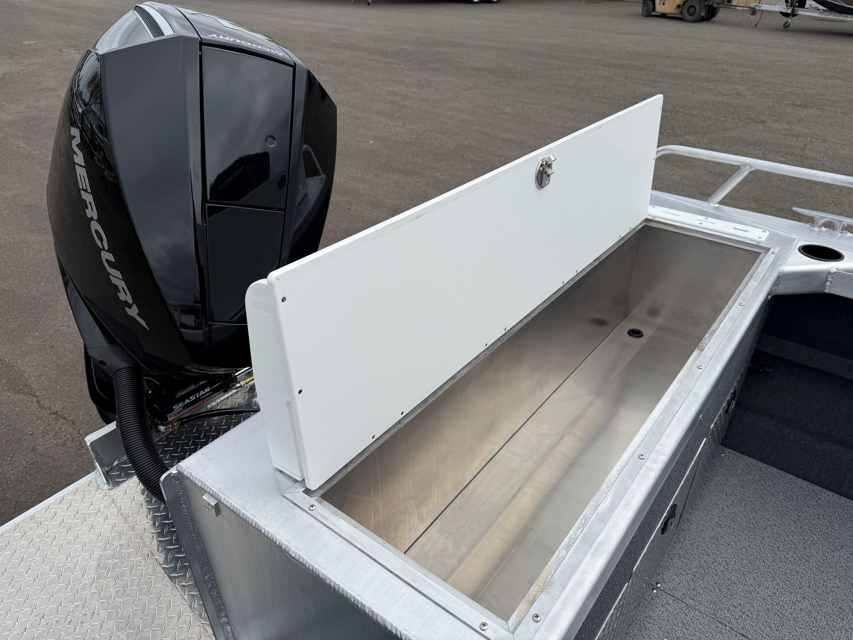 2025 Thunder Jet 210 Luxor boat with Mercury engine and open storage compartment.