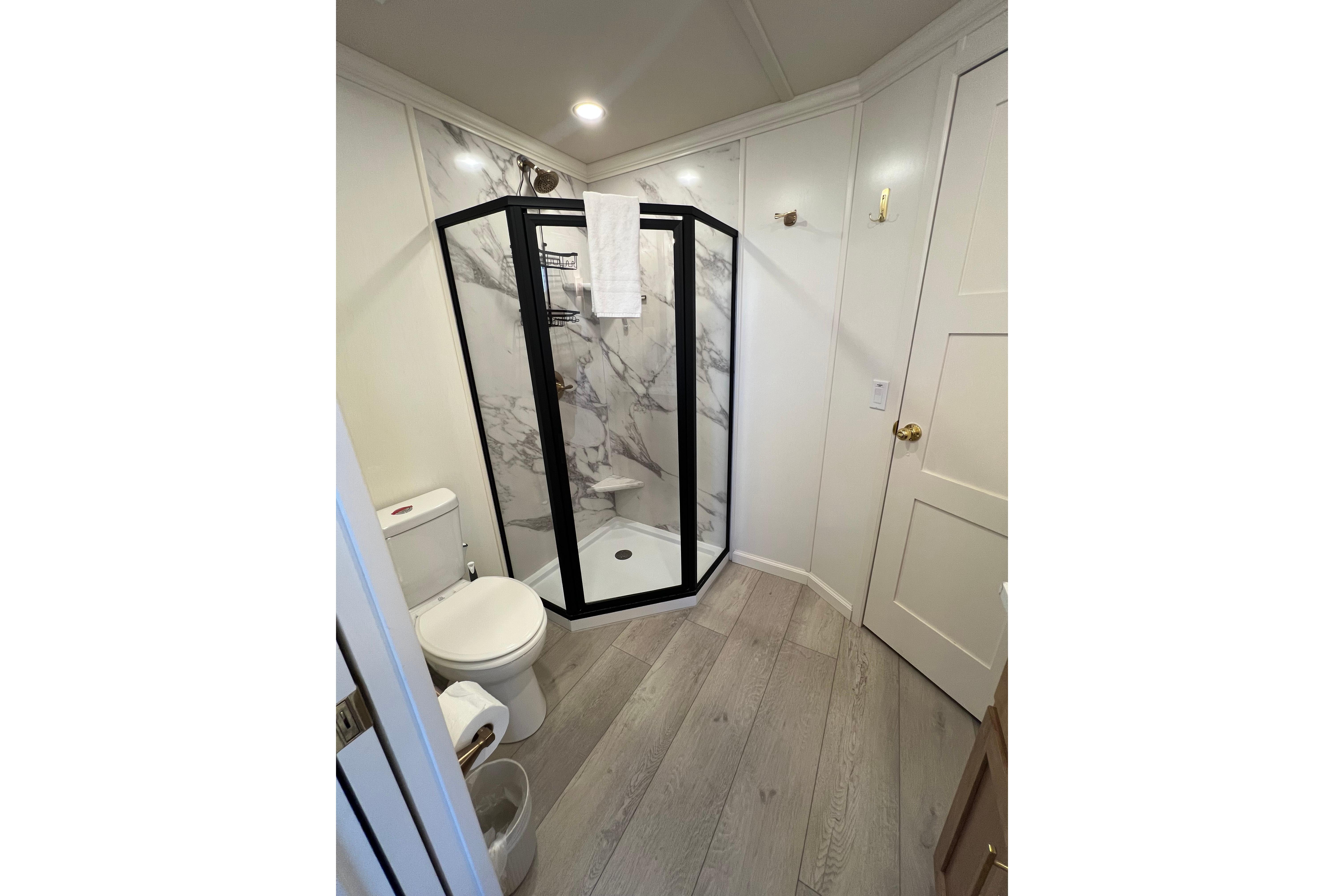 Modern bathroom with marble shower in 2025 Sumerset Excellence Multiple Shares.