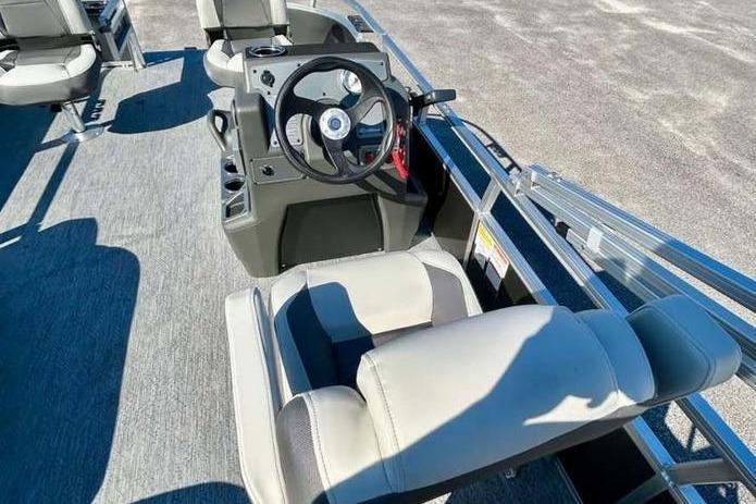 2026 Sun Tracker Bass Buggy 16 XL Select boat interior with steering console and seating.