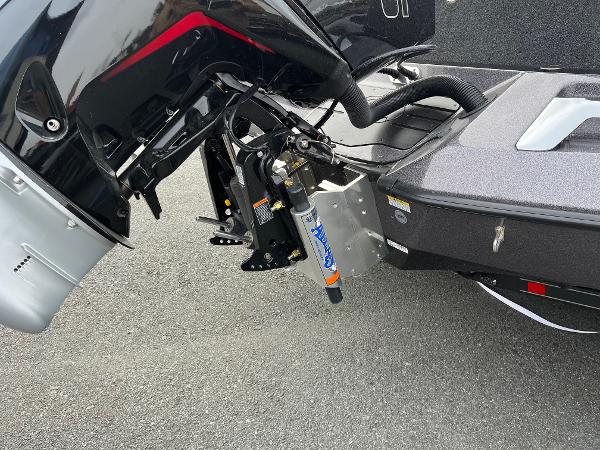 2025 Ranger Z520 boat motor and transom detail on asphalt surface.