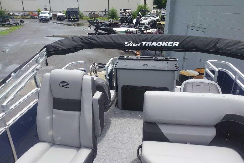 2026 Sun Tracker SportFish 20 DLX pontoon boat interior with seating and console.