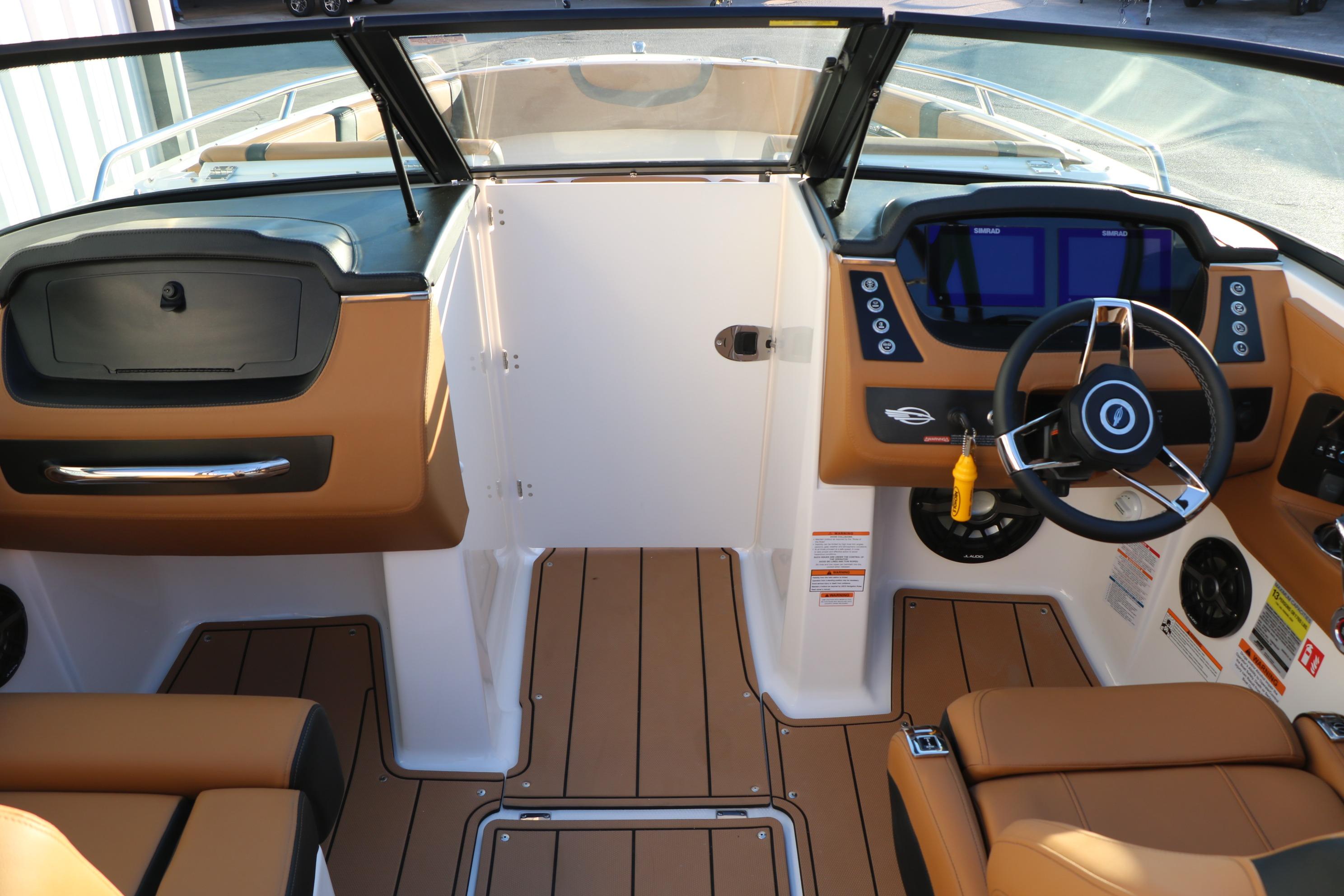 2026 Chaparral 247 SSX boat interior with modern dashboard and steering wheel.
