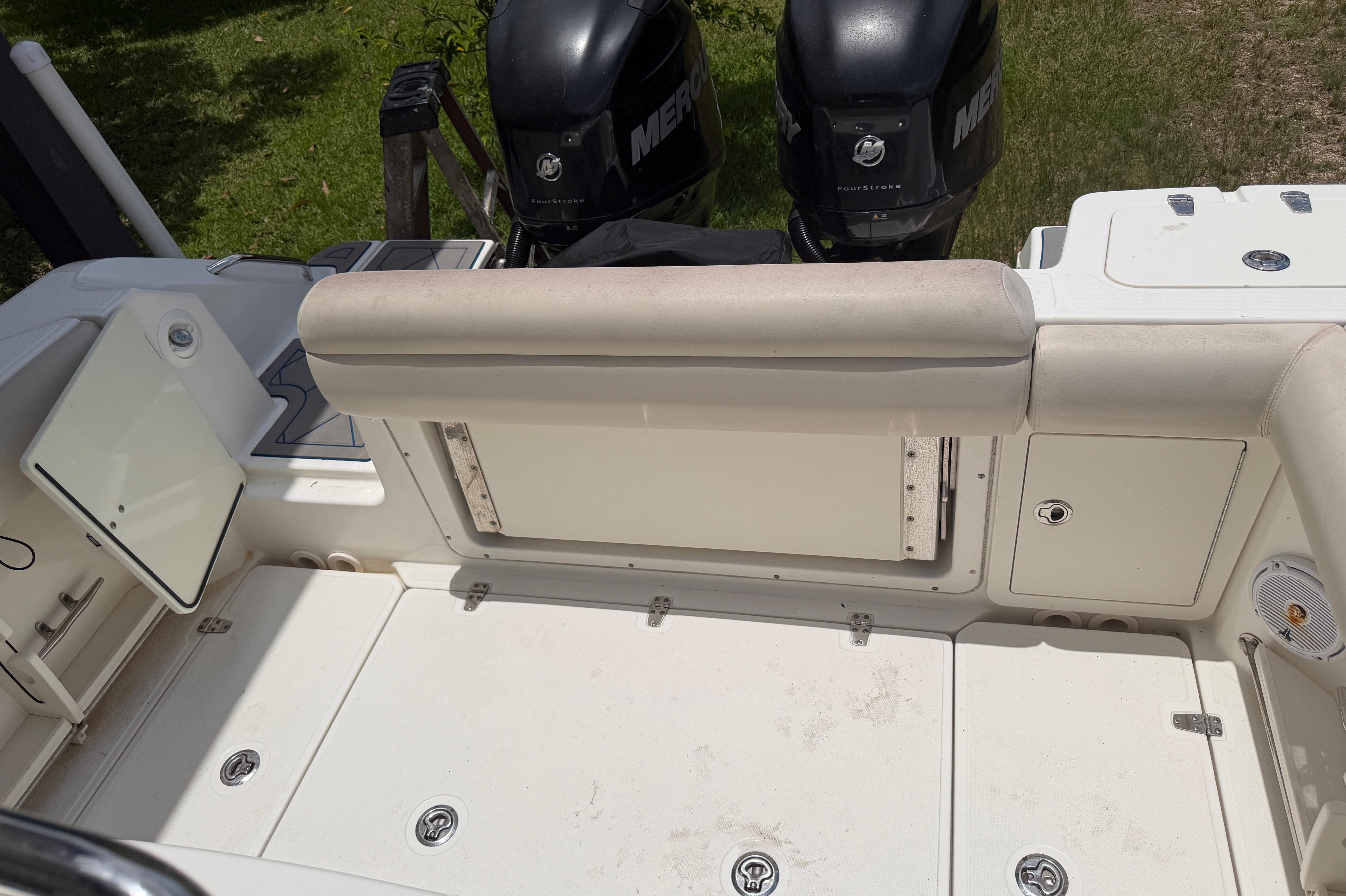 2016 Boston Whaler 250 Outrage boat interior with dual Mercury outboard engines.
