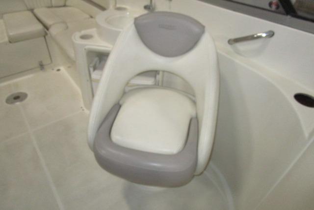 2004 Stingray 240 LR boat interior with swivel seat and white upholstery.