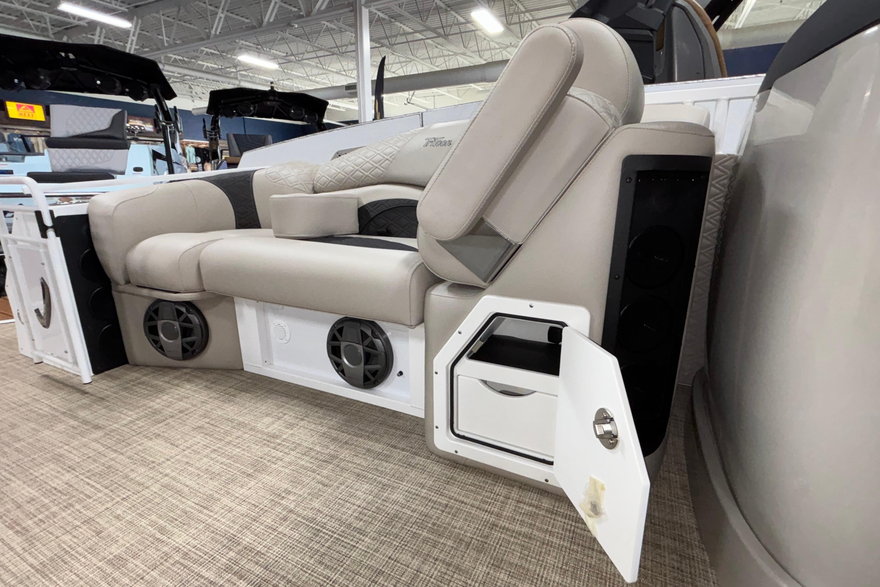 Luxurious seating on the 2026 JC Sporttoon 26TT boat with integrated speakers and storage.