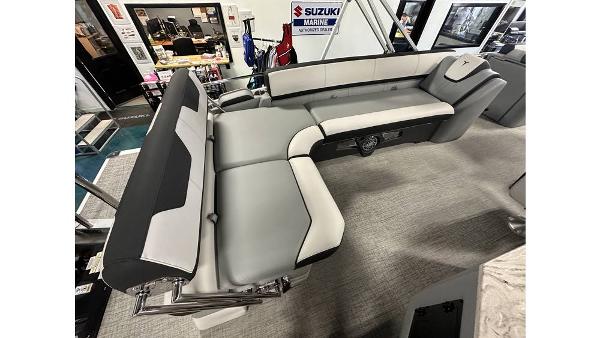 2025 Tahoe Pontoon Cascade Cruise Rear Bench with modern seating design in showroom.