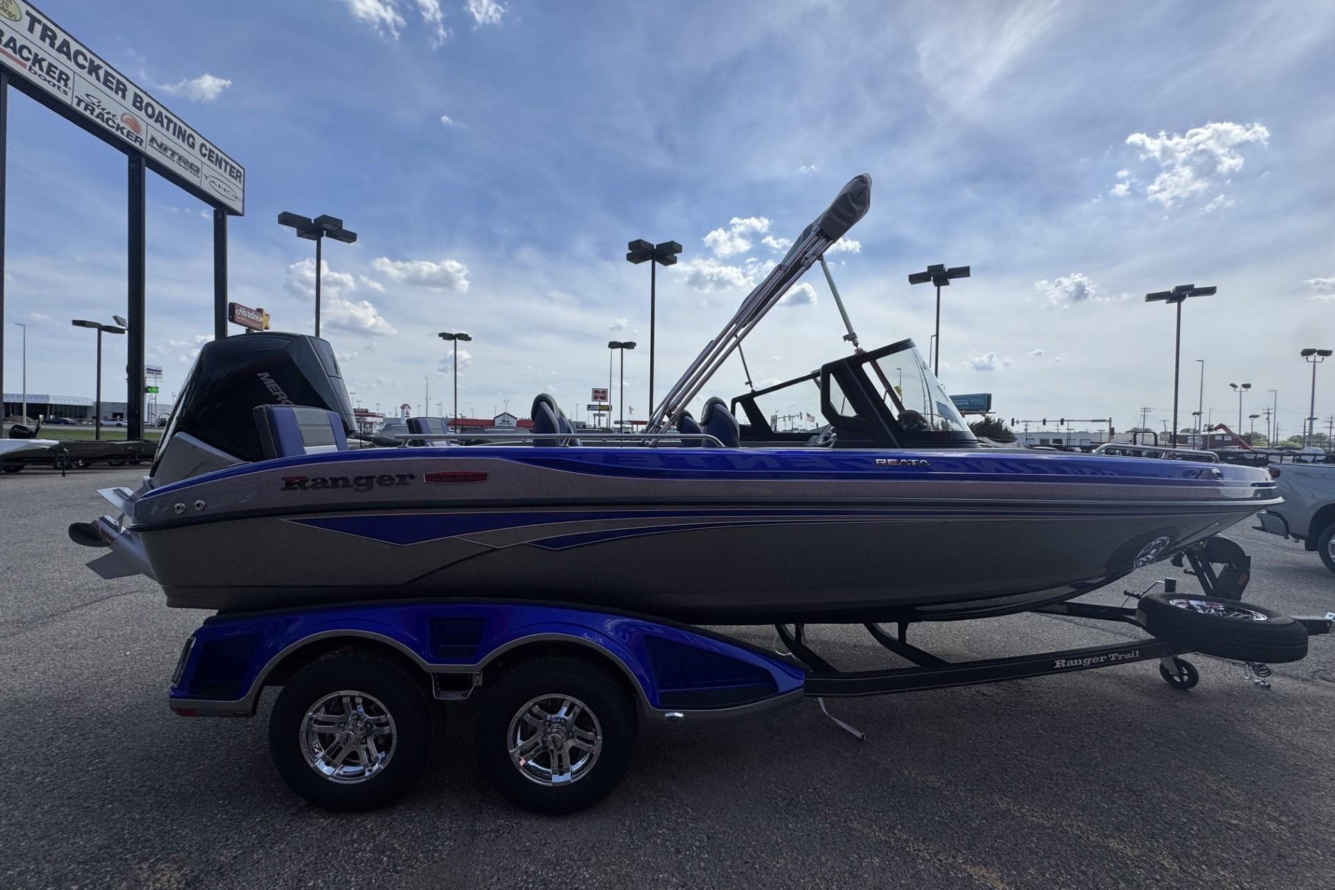 2026 Ranger 2050MS boat on trailer at dealership under clear sky.