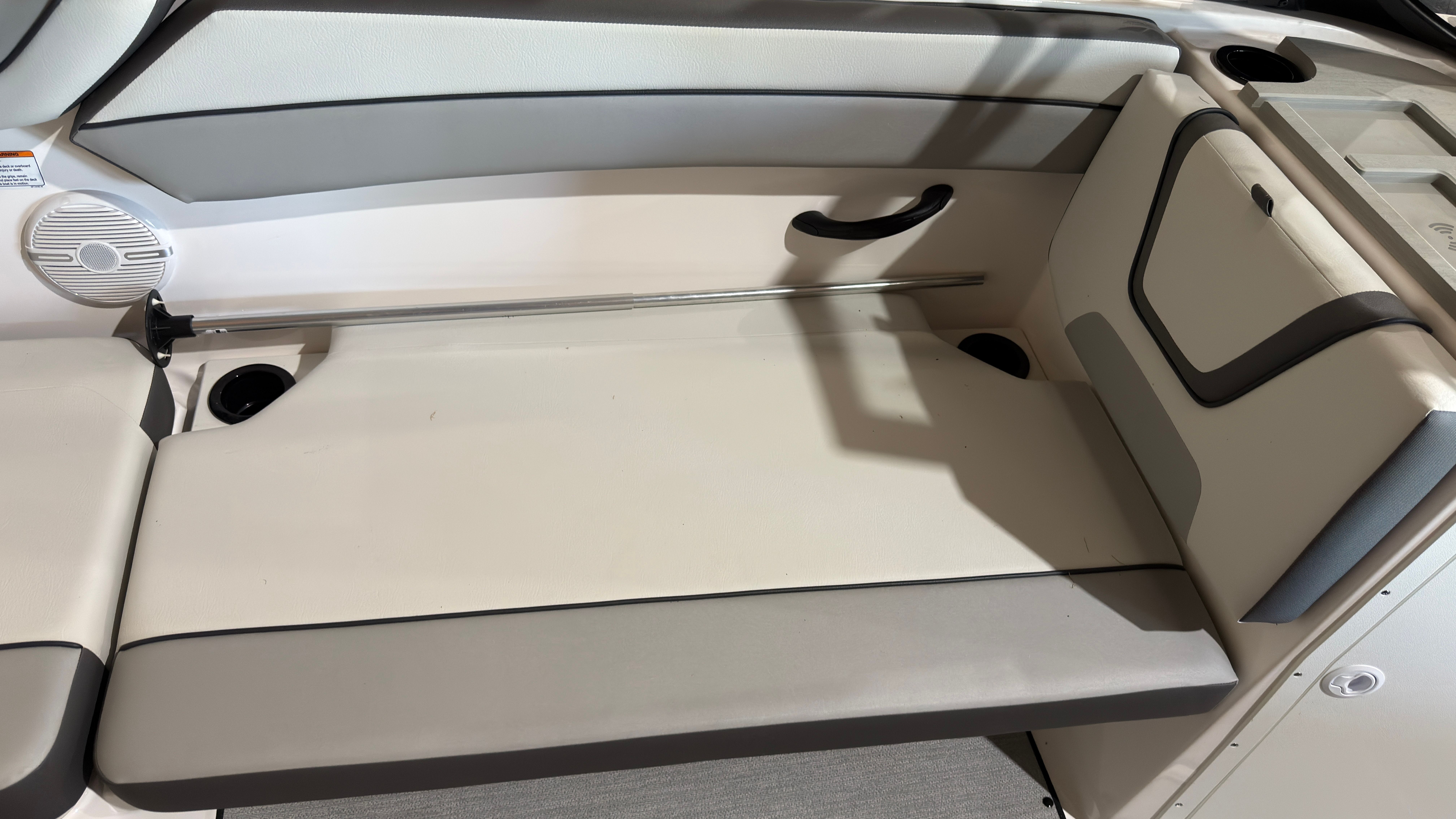 Interior of 2024 Yamaha Boats AR220 with gray and white seating.