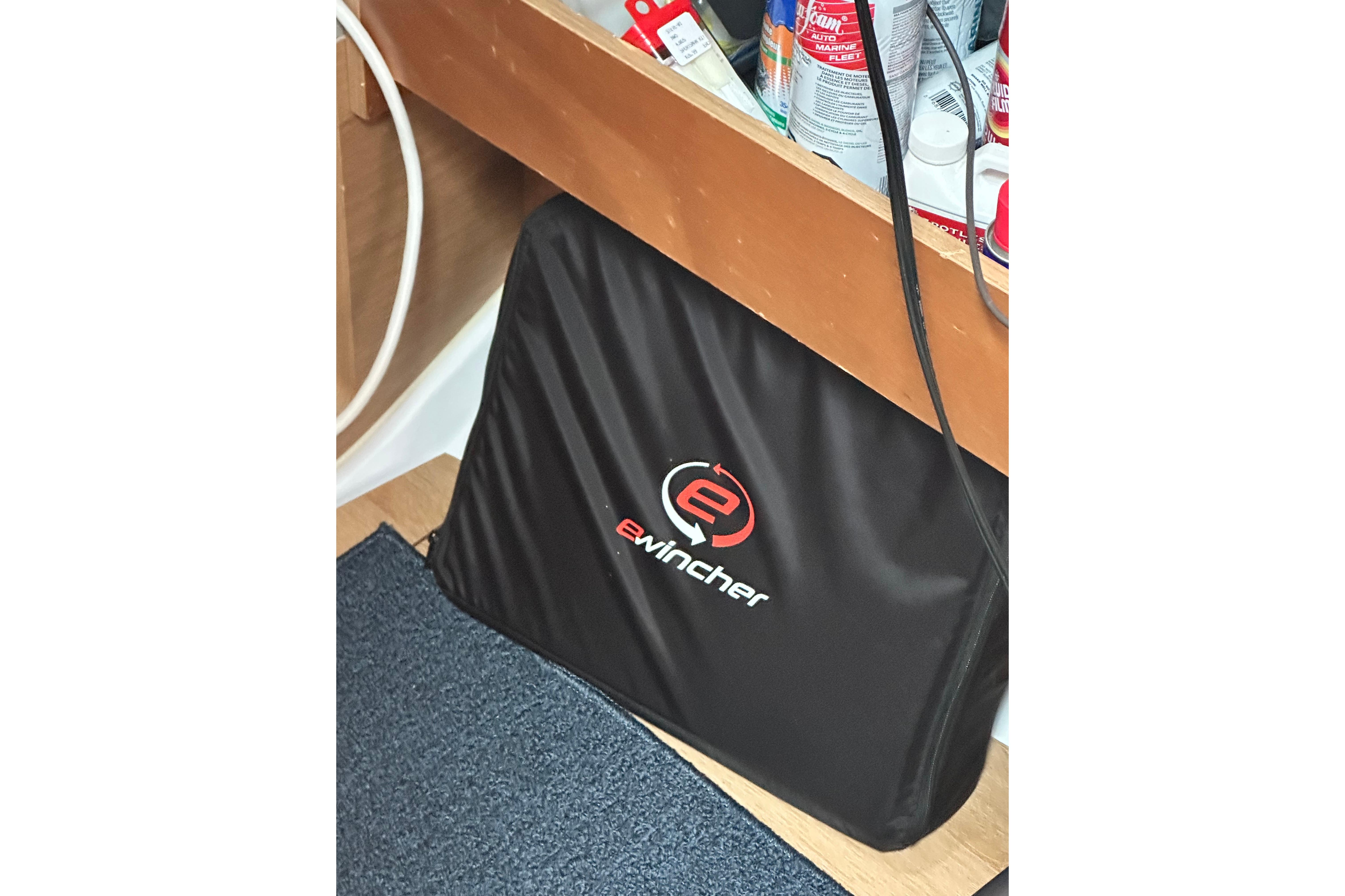 Storage area on Jeanneau Sun Odyssey 440, featuring eWincher bag and marine supplies.