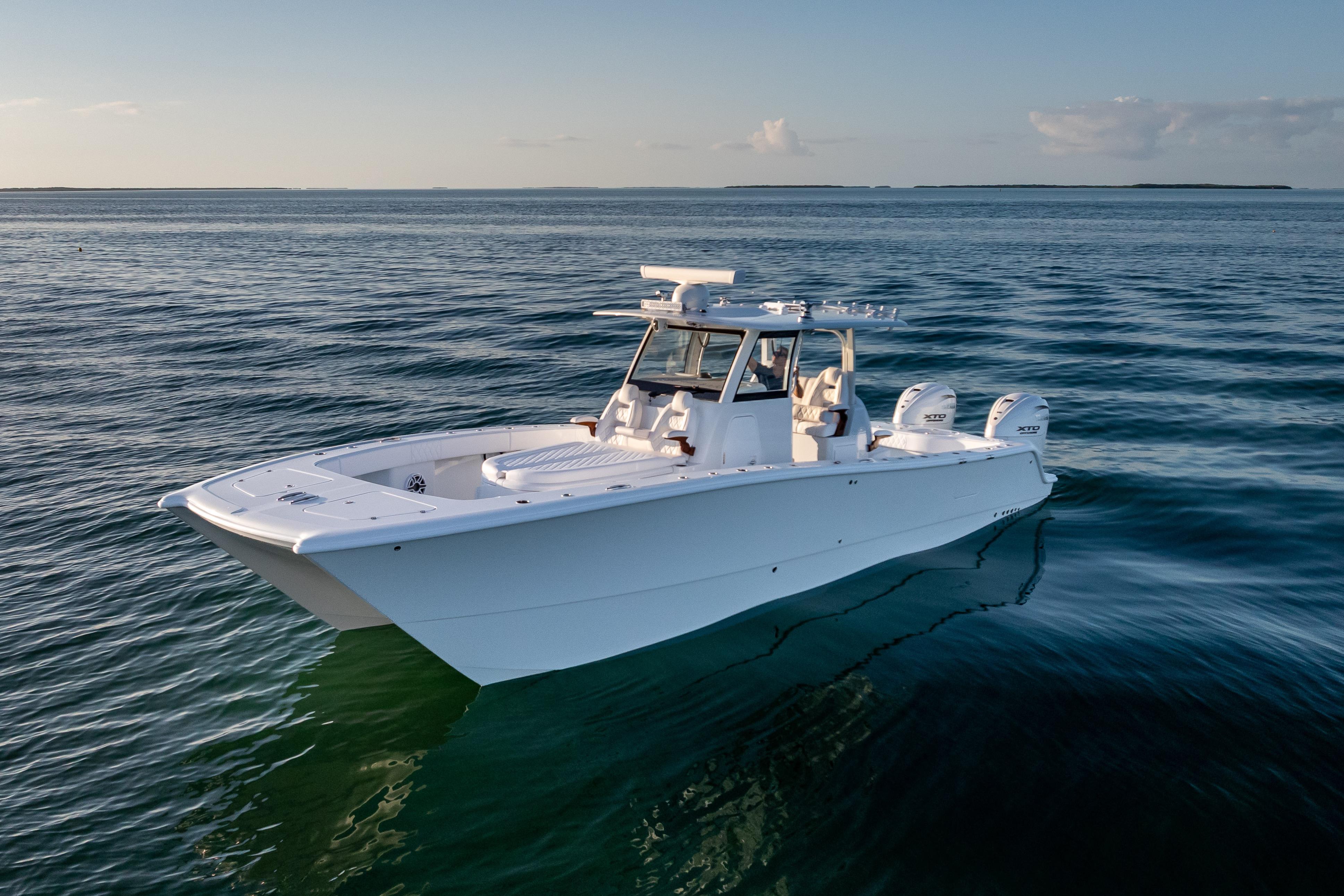 2026 Freeman 35 boat on calm ocean waters at sunset.
