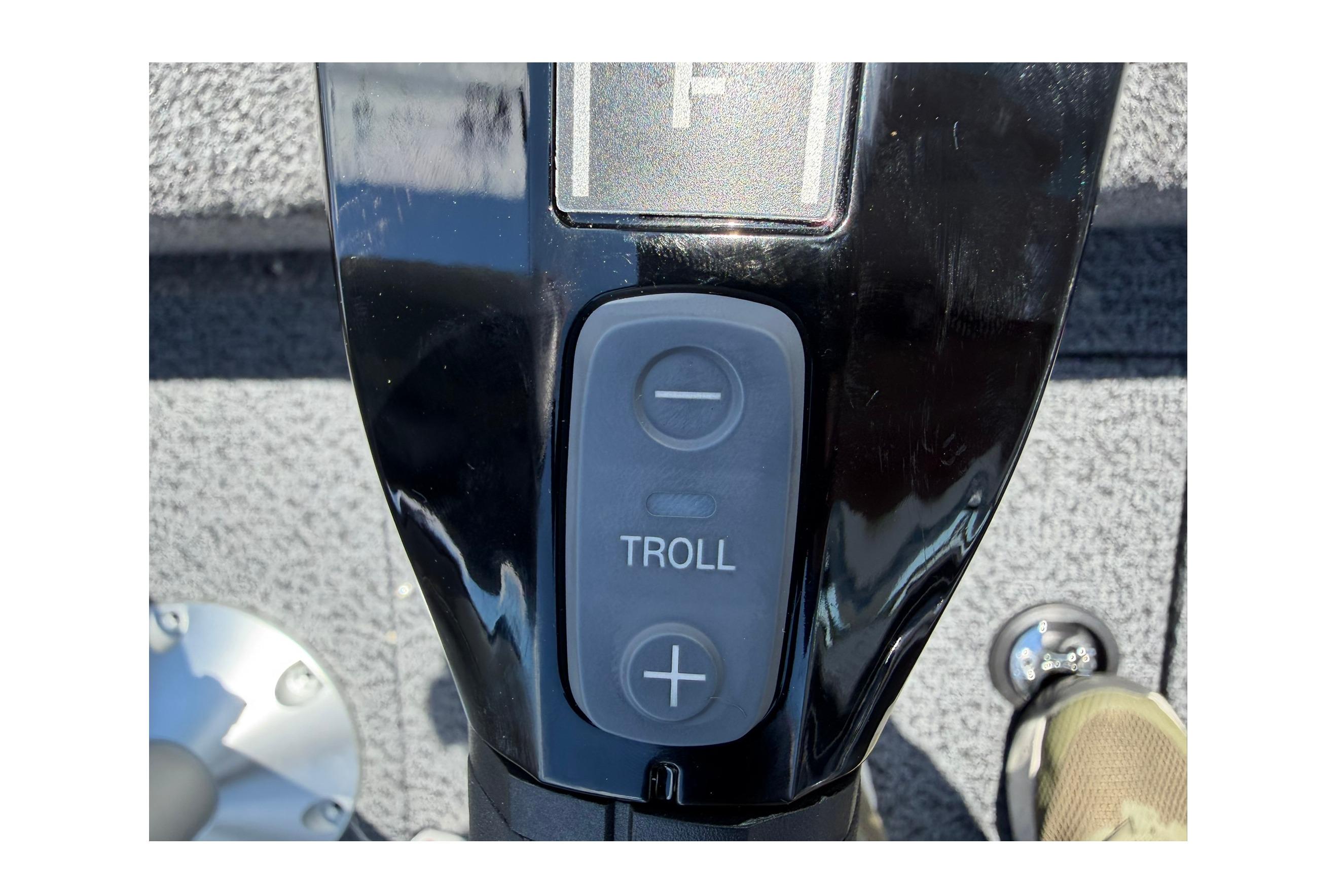 Close-up of 2027 Lund 1875 Pro Guide boat control panel with troll speed buttons.