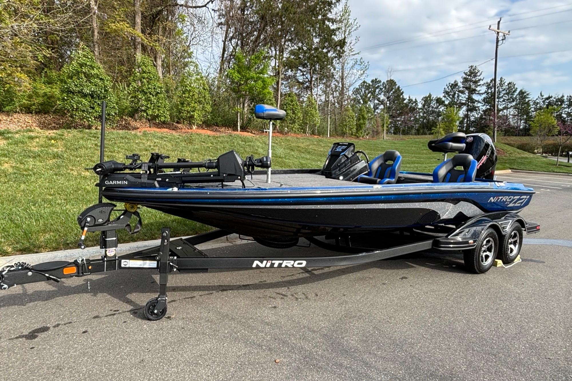 2026 Nitro Z21 XL Pro fishing boat on trailer, parked outdoors.