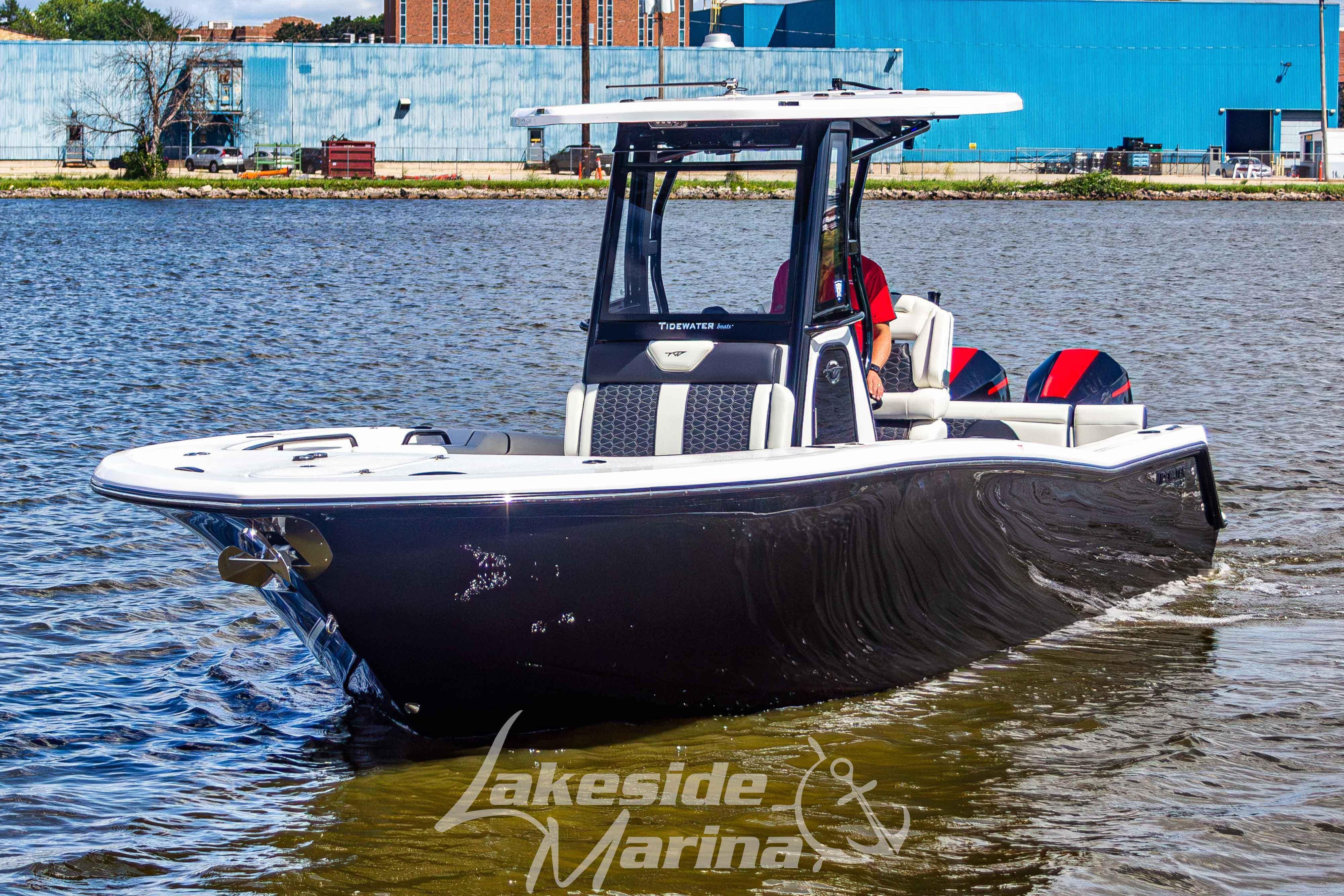 2026 Tidewater 256 LXF boat cruising on a lake near Lakeside Marina.