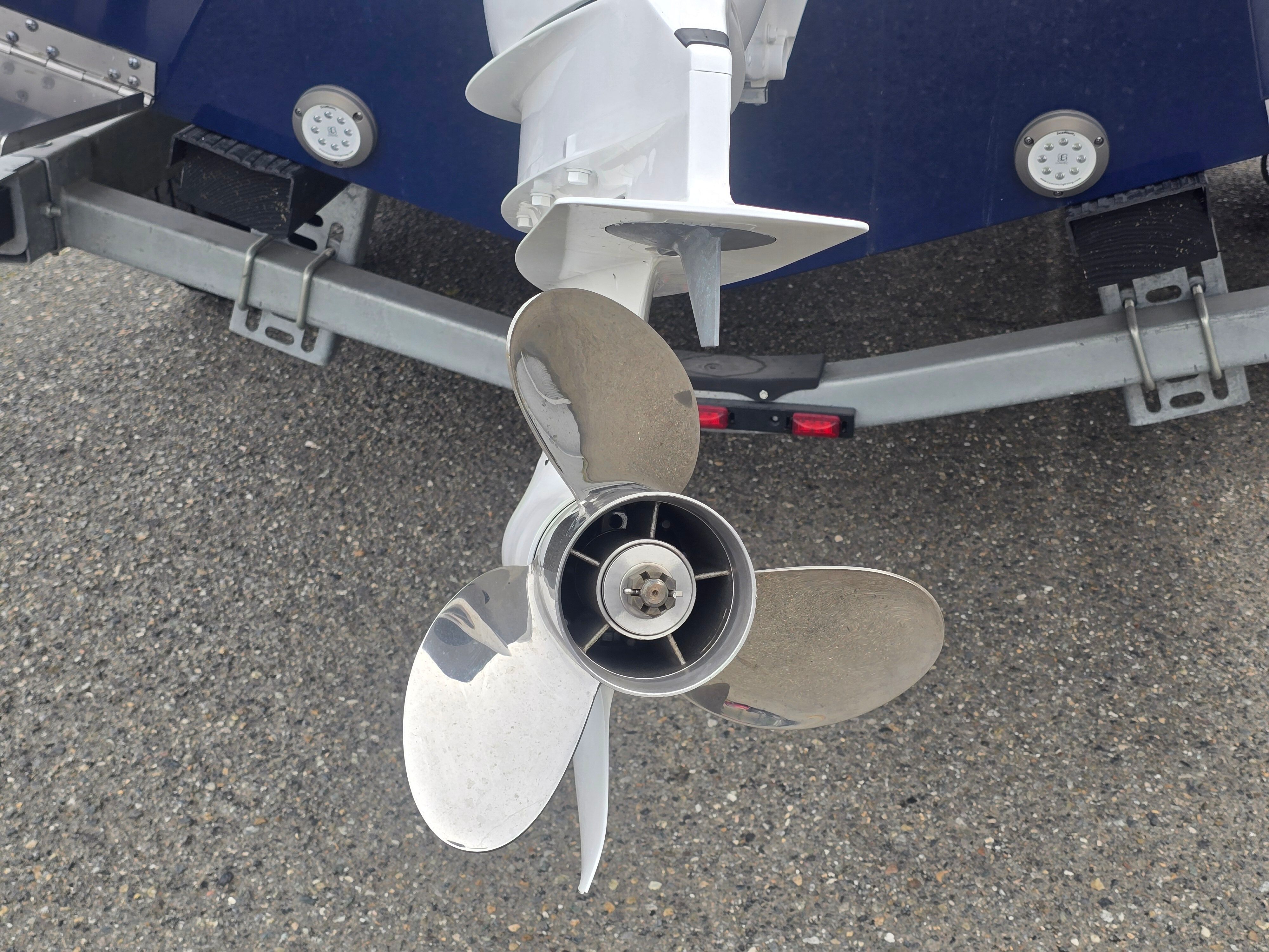 Close-up of a boat propeller on a trailer.