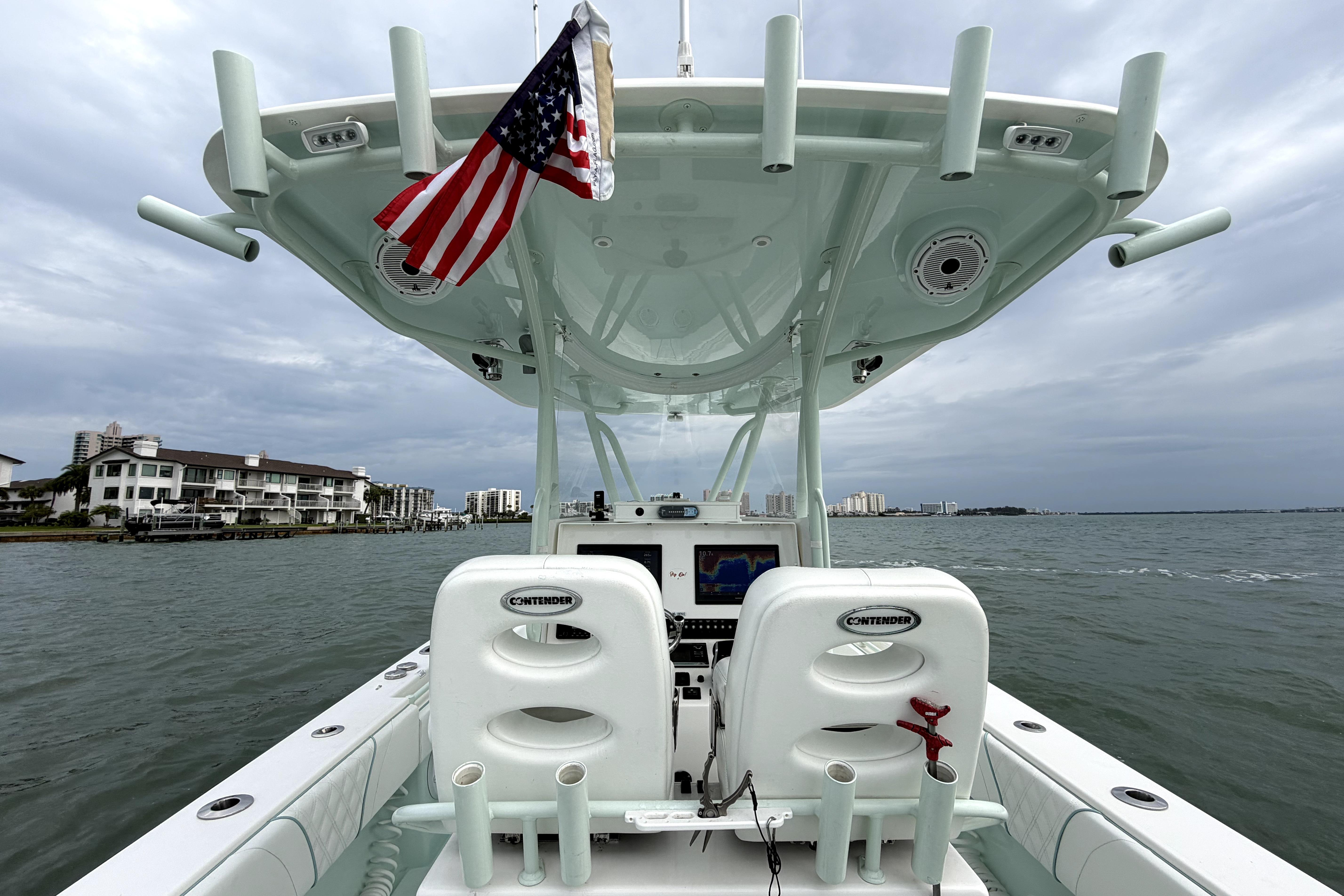 2019 Contender 30 ST boat on water, featuring dual seats and American flag.