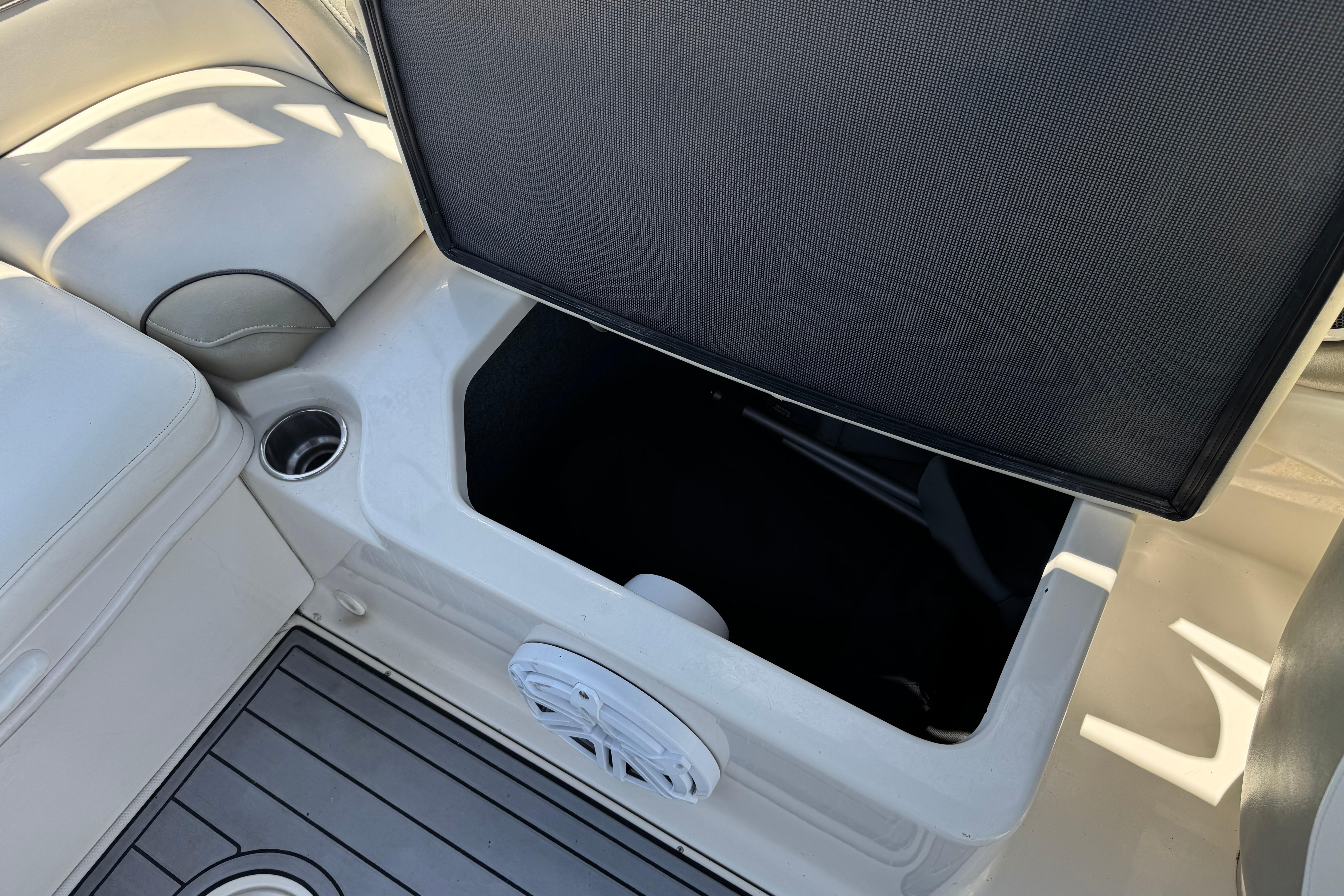 Open storage compartment on 2007 Sea Ray 240 Sundeck boat interior.