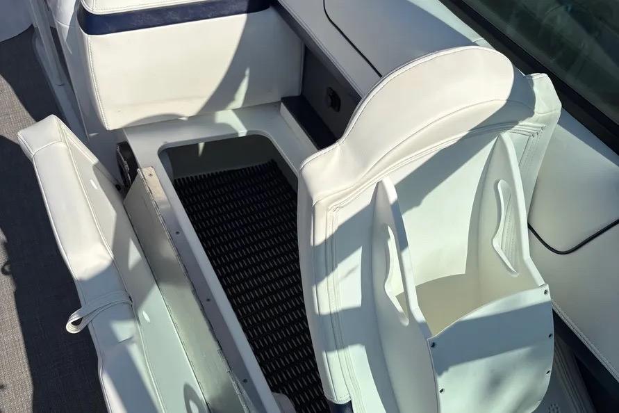 2015 Formula 350 Crossover Bowrider interior with white seating and storage compartment.