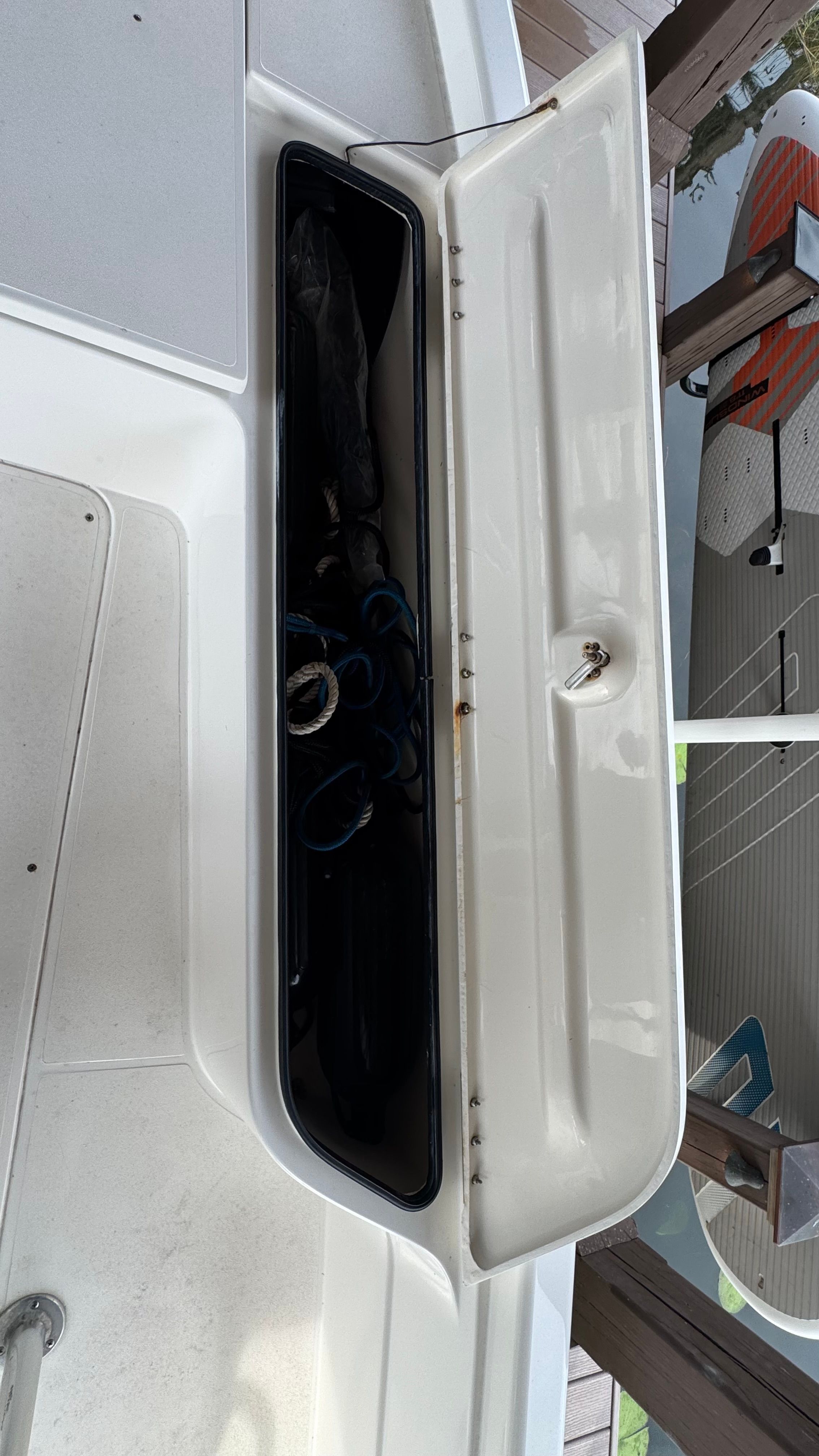 Open storage compartment on a 2004 ShearWater LTZ boat.