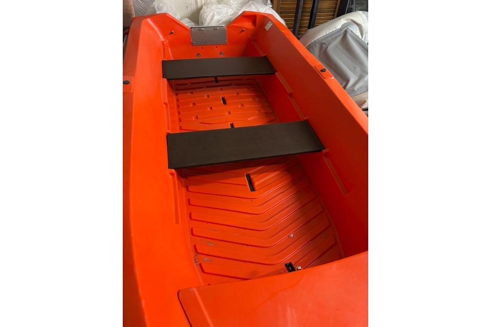 Orange River Boats 350, 2022 model, featuring a spacious interior with black seating.