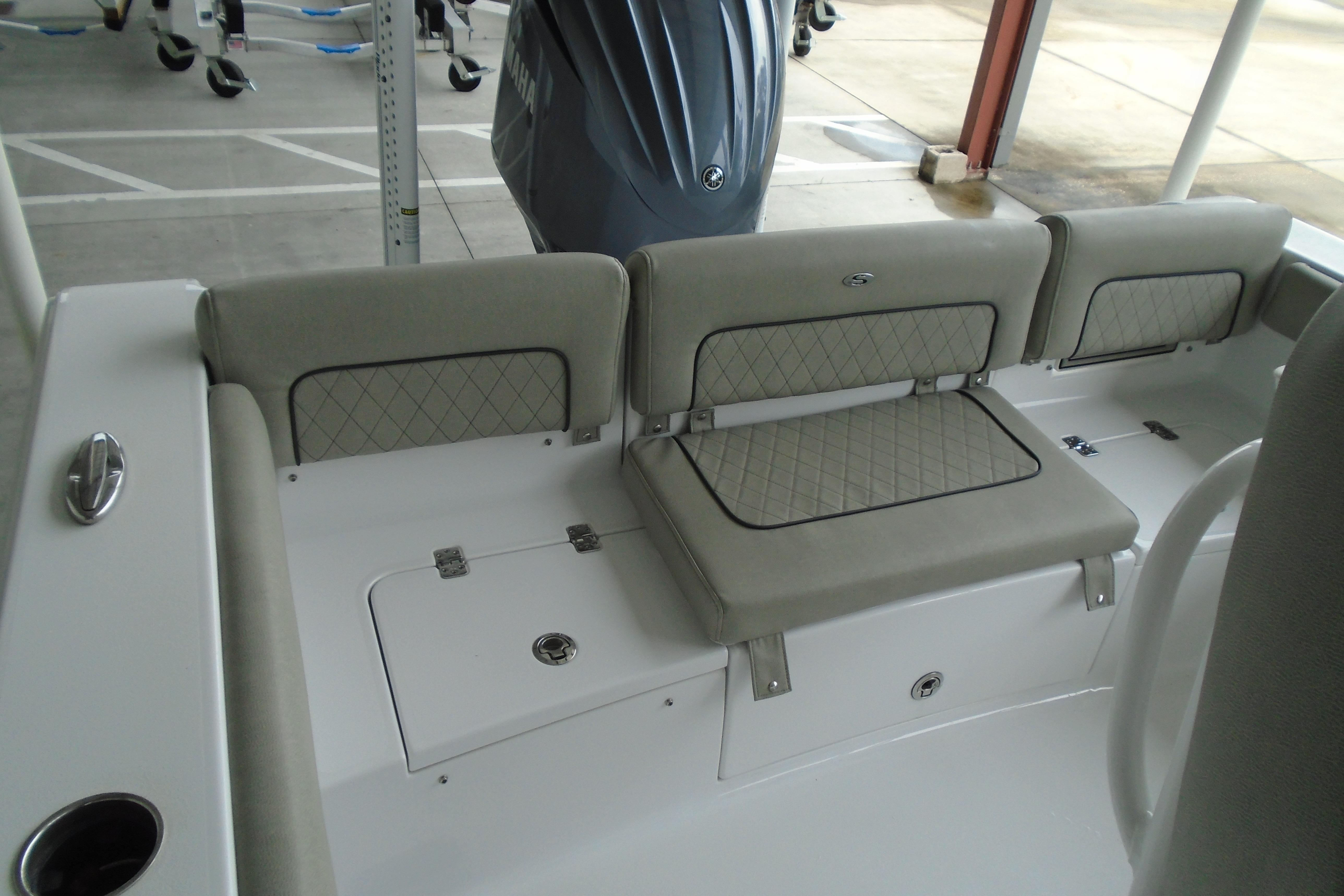 2022 Sportsman Heritage 241 Center Console boat seating area with cushioned backrests.
