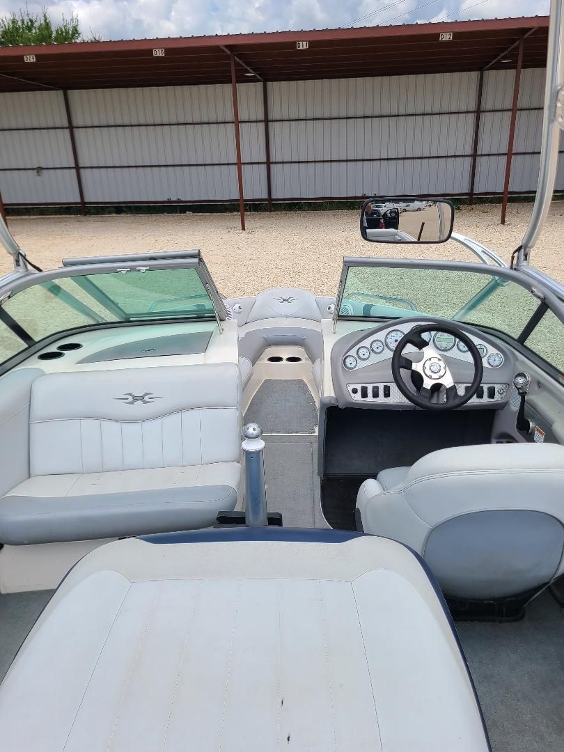 2003 MasterCraft X-9 boat interior with steering wheel and seating.