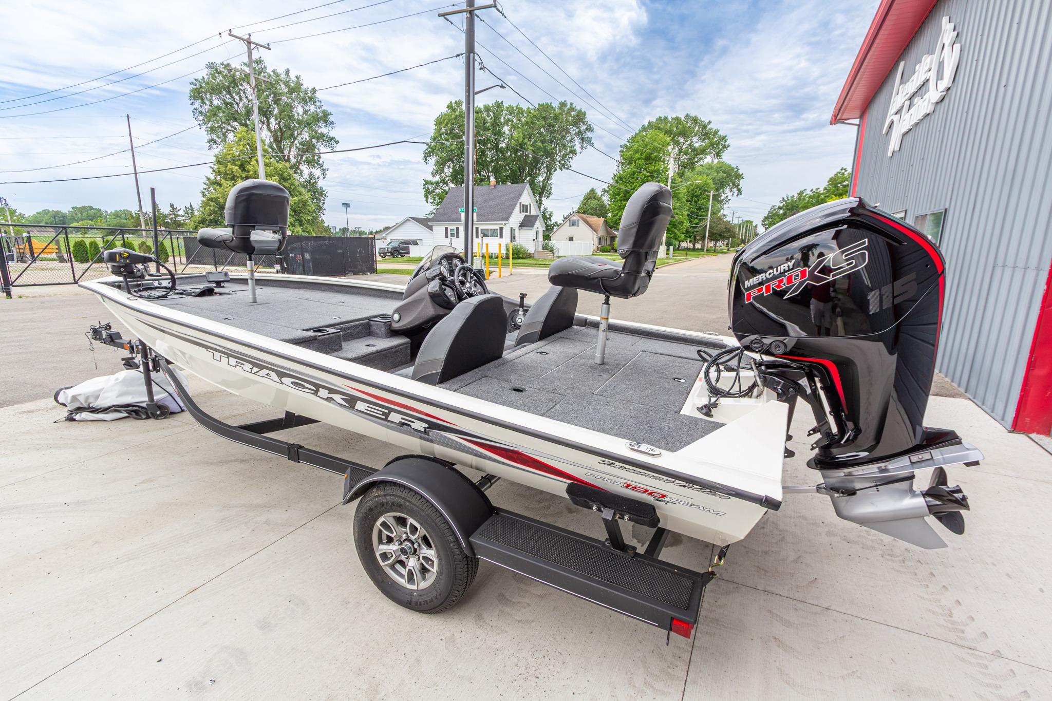 2023 Tracker Pro Team 190 TX boat with Mercury Pro XS engine, parked outdoors.