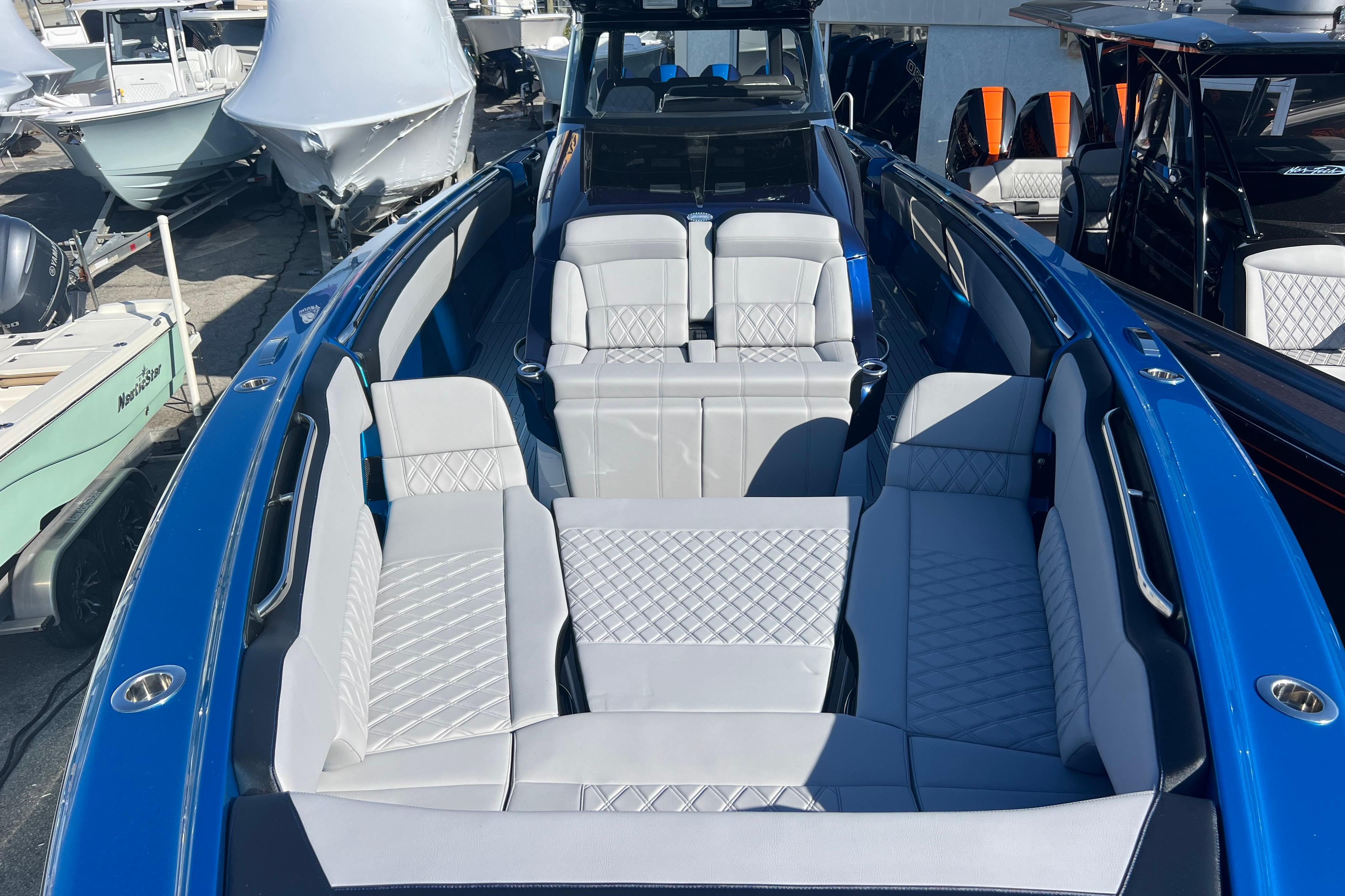 2026 Nor-Tech 450 Sport boat with luxurious seating and sleek blue design.