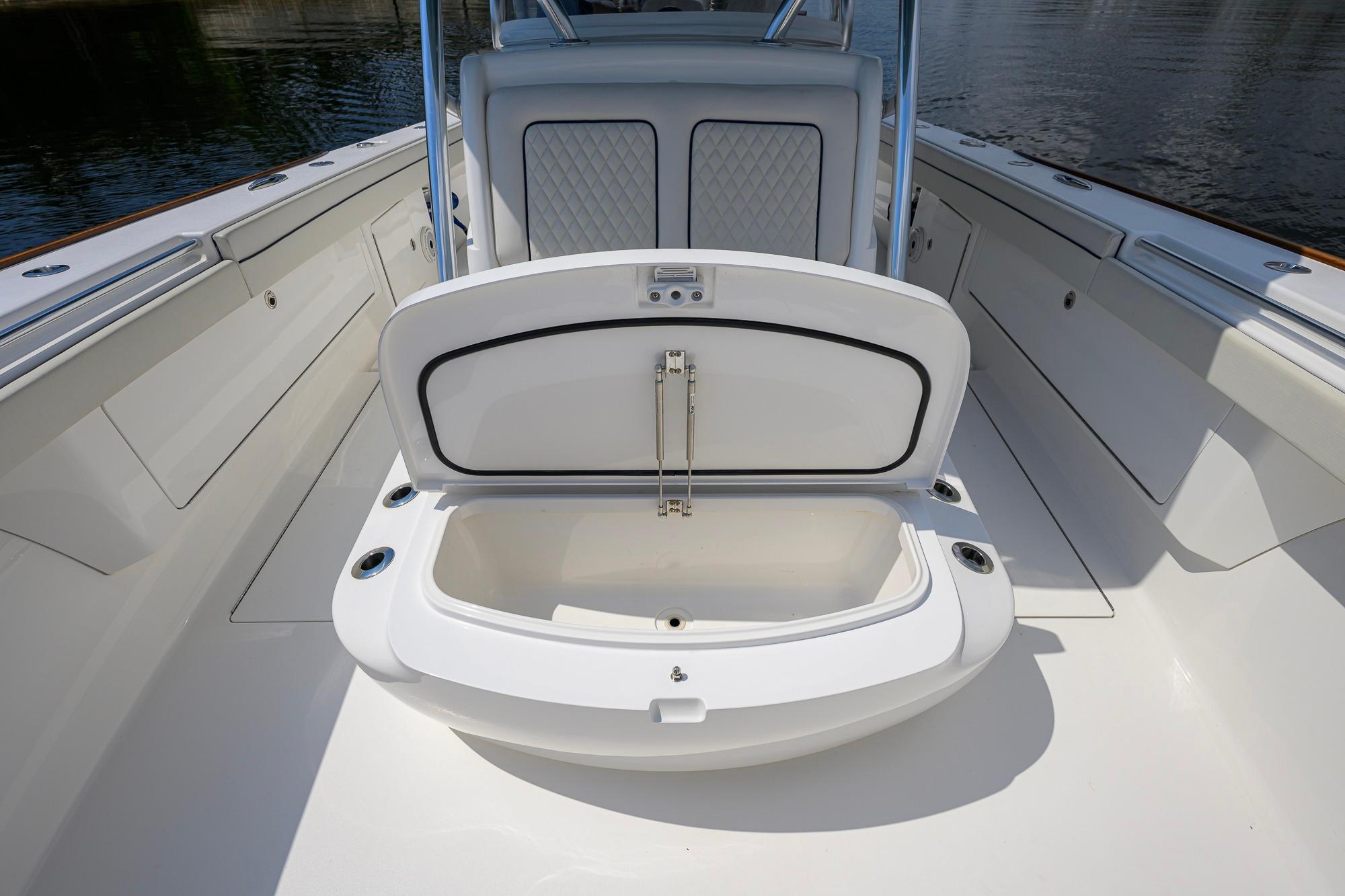 2020 Valhalla Boatworks V-41 interior with open storage compartment on deck.