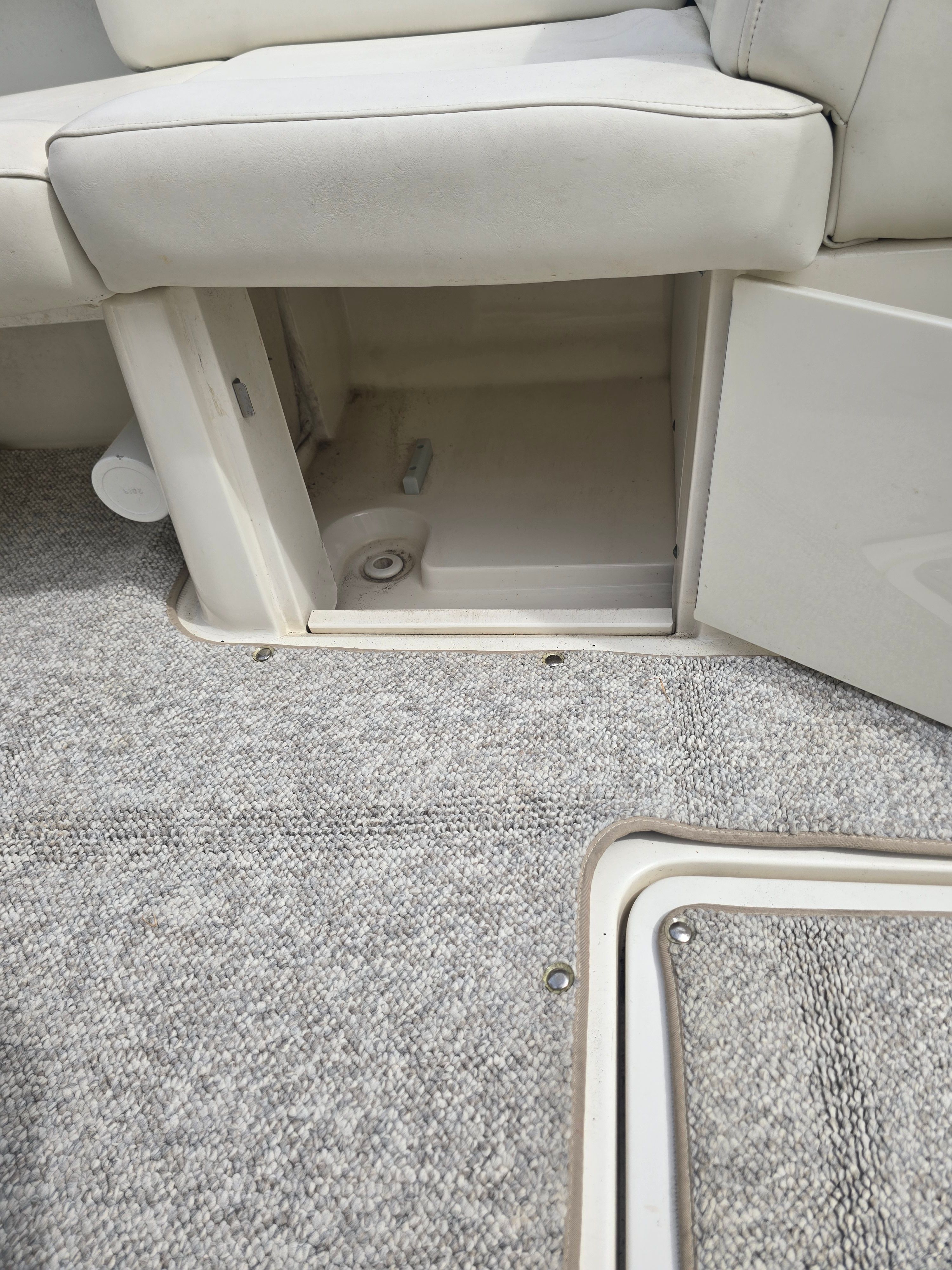 Interior of a 2007 Sea Ray 270 Select EX boat with storage compartment.