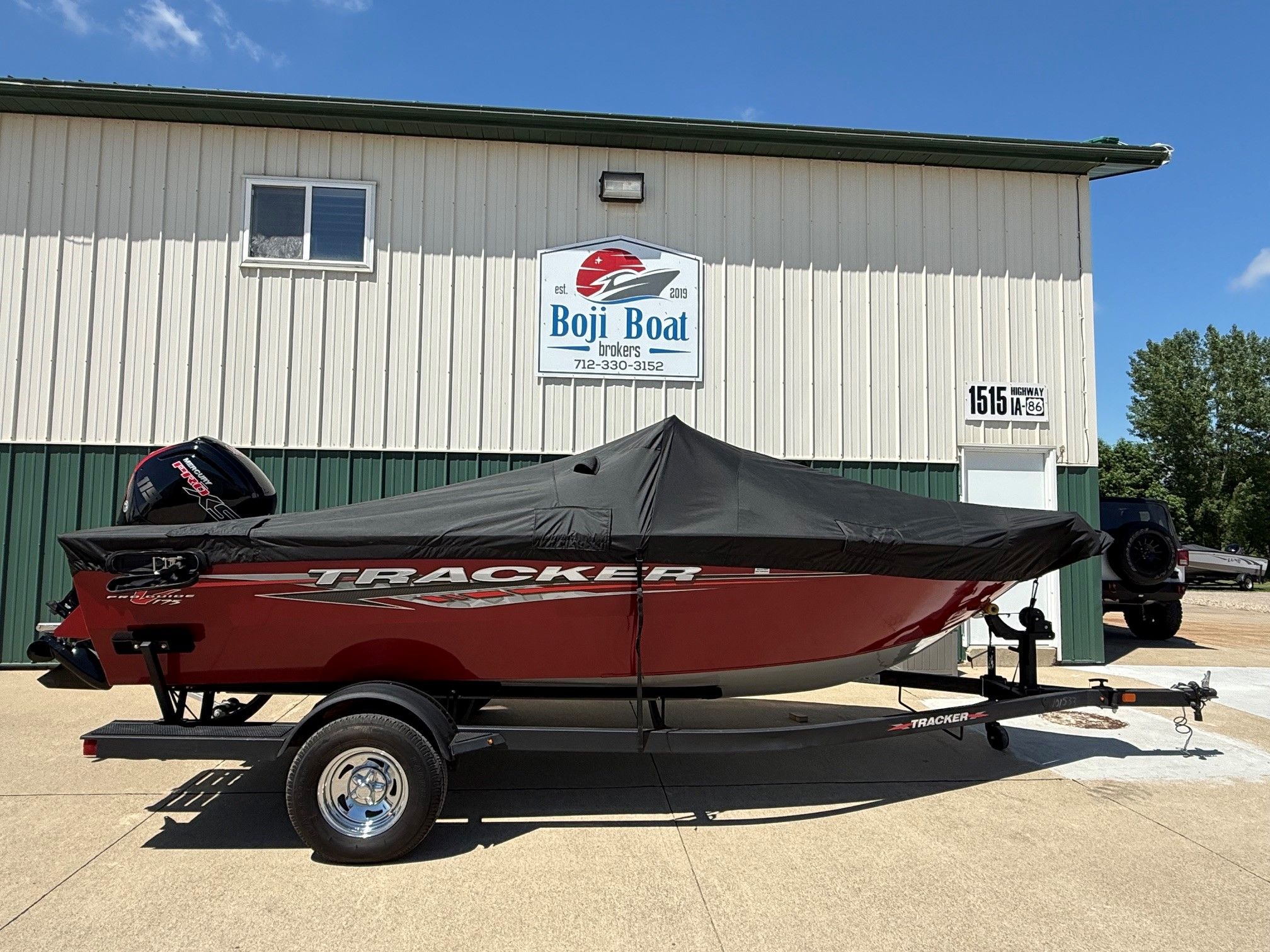2024 Tracker Pro Guide V175 boat with cover on trailer.